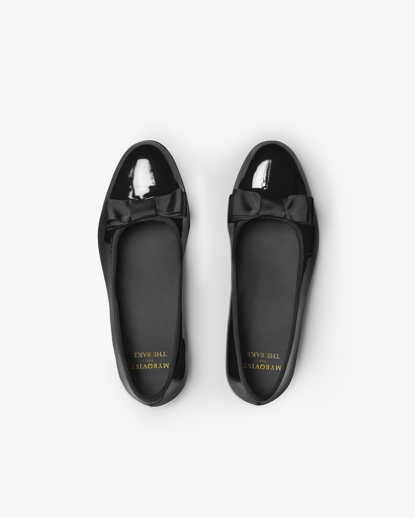 Top-down view of Rosendal – Black Patent Leather opera pumps, showcasing the elegant bow and glossy finish.