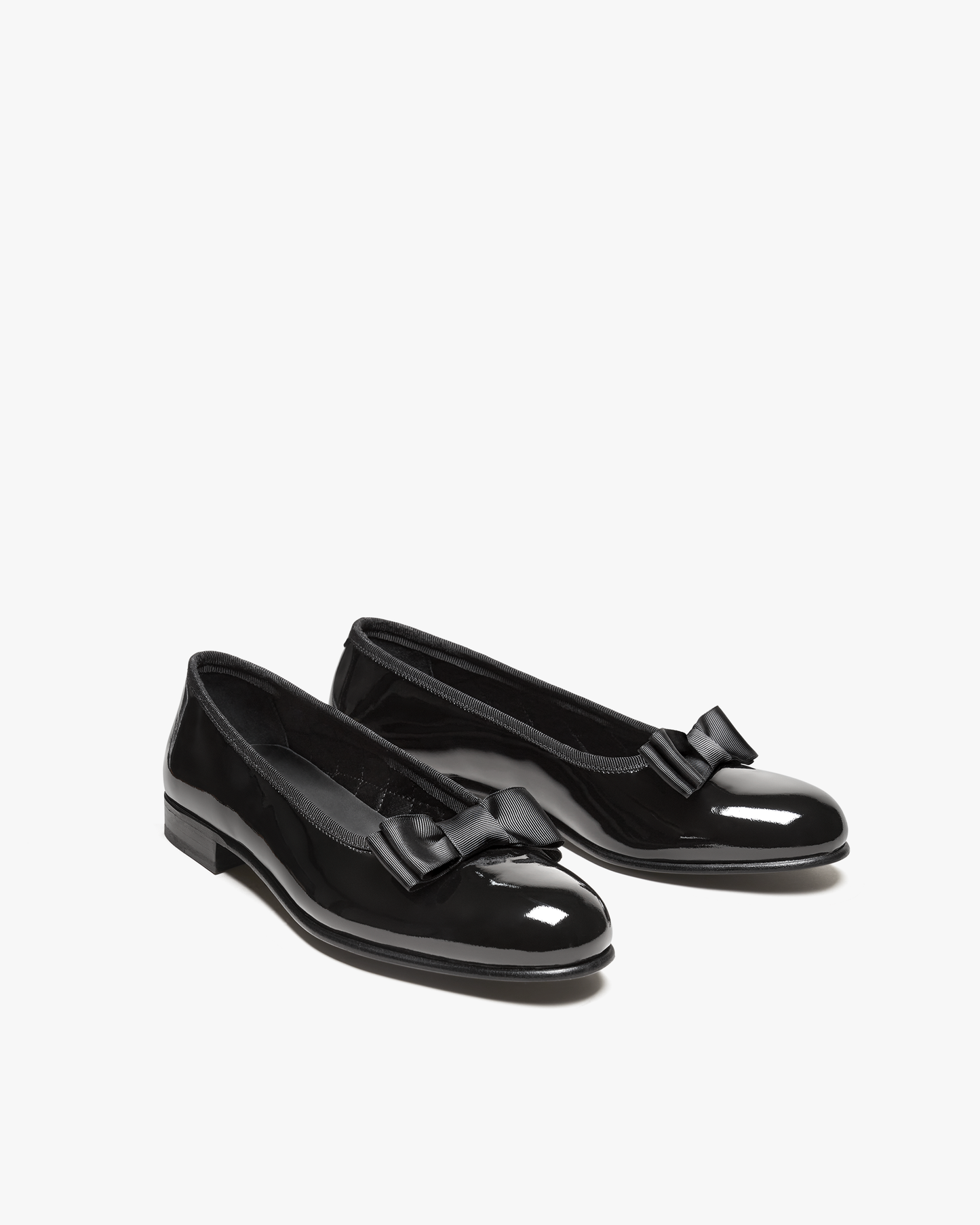 A pair of Rosendal – Black Patent Leather opera pumps photographed from a three-quarter angle against a white background.