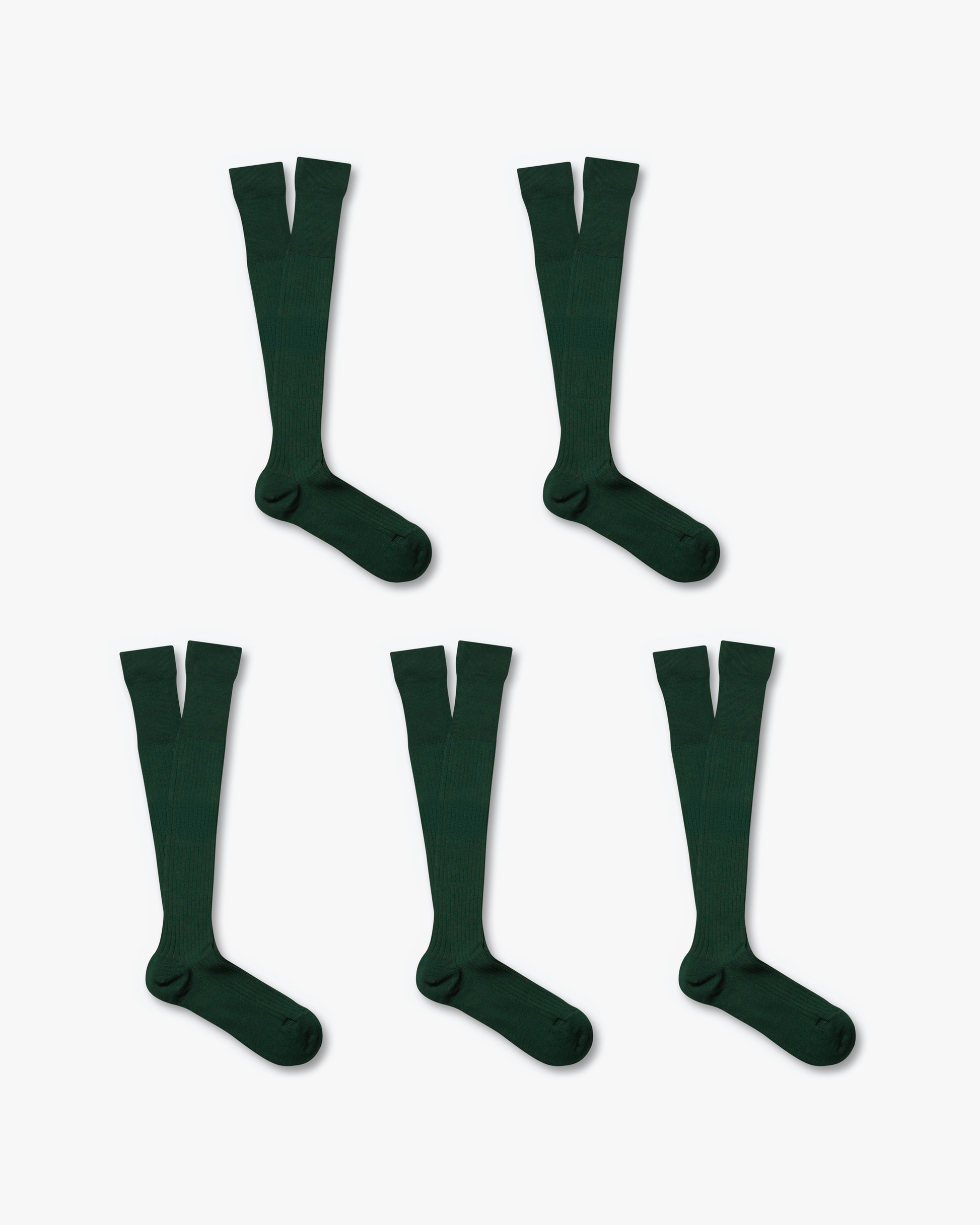 A flat lay of five pairs of Nils – Knee-High Cotton Socks in dark green, against a white background.