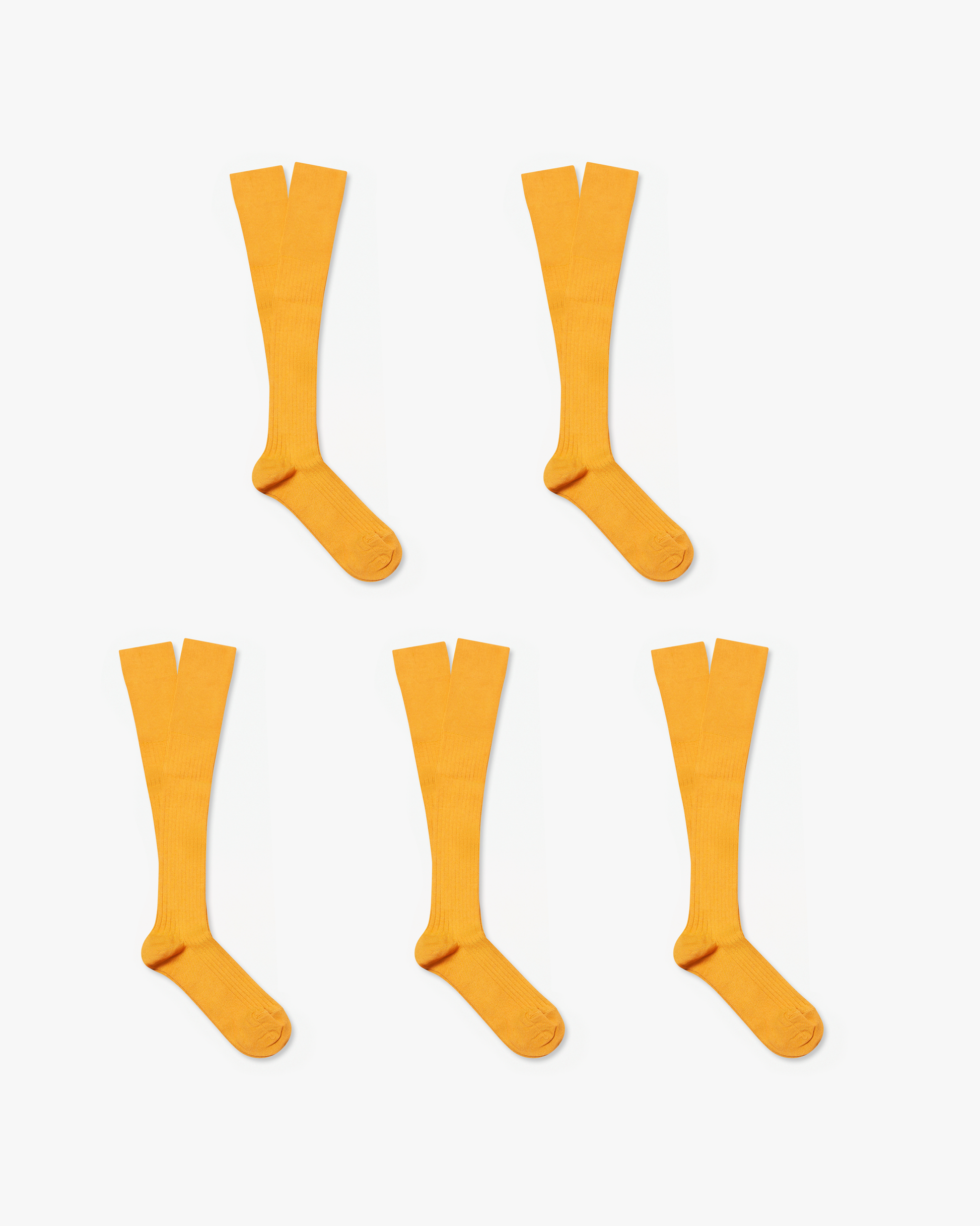 A flat lay of the Nils – Knee-High Cotton Socks – 5-pack in yellow, showing all five pairs on a white background.