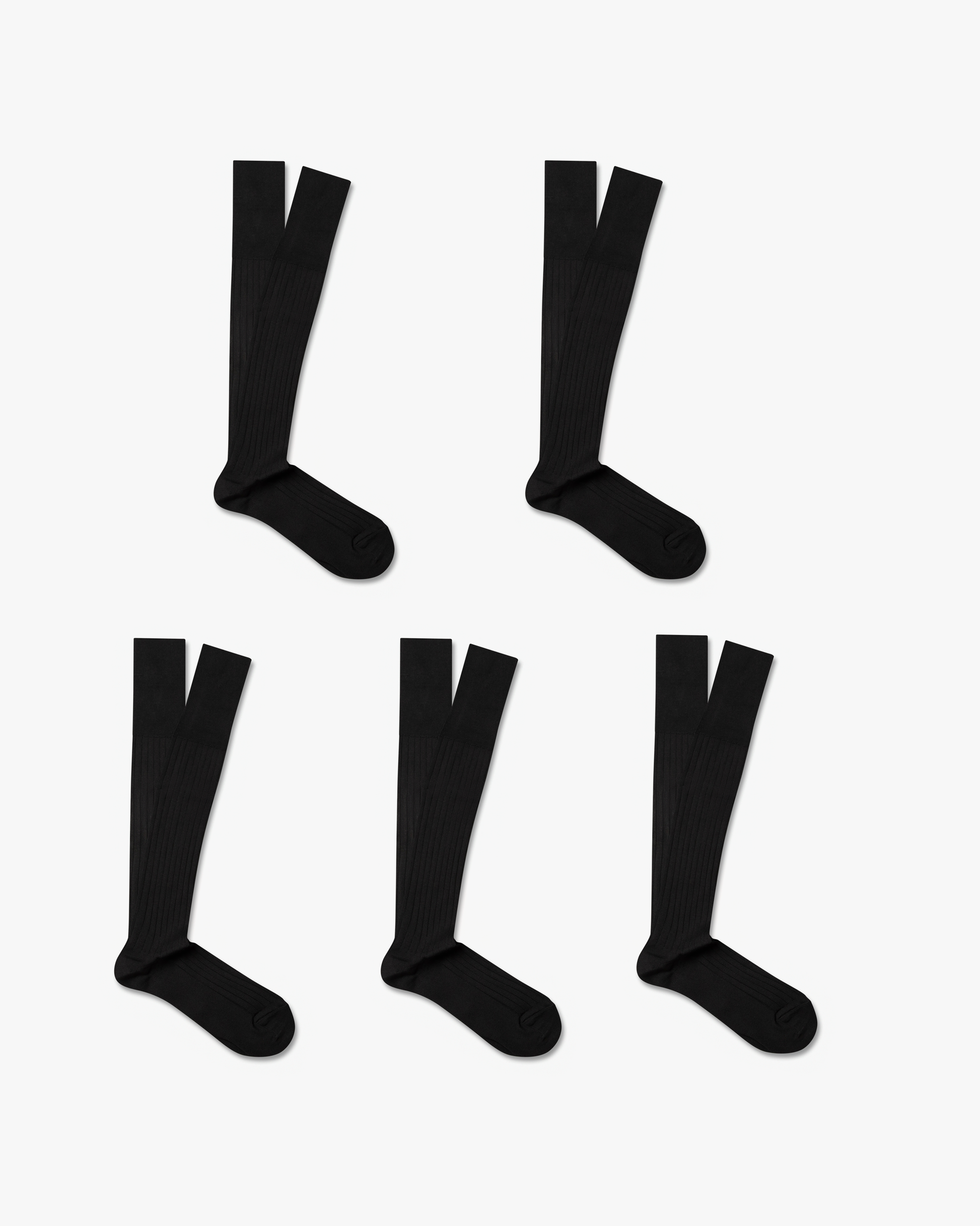 Five pairs of black, ribbed Nils – Knee-High Cotton Socks laid out against a white background.