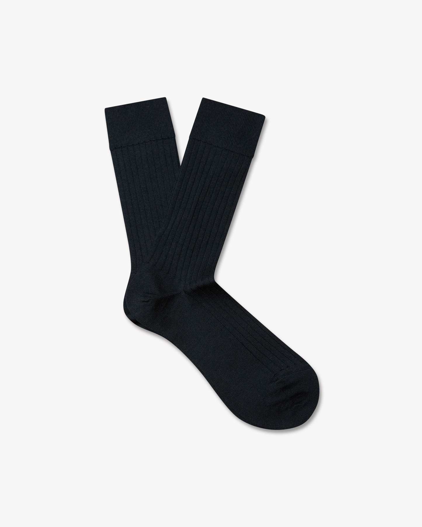 A pair of Ludvig – Merino Wool Socks – Navy laid flat, showcasing the calf-length cut and ribbed texture.
