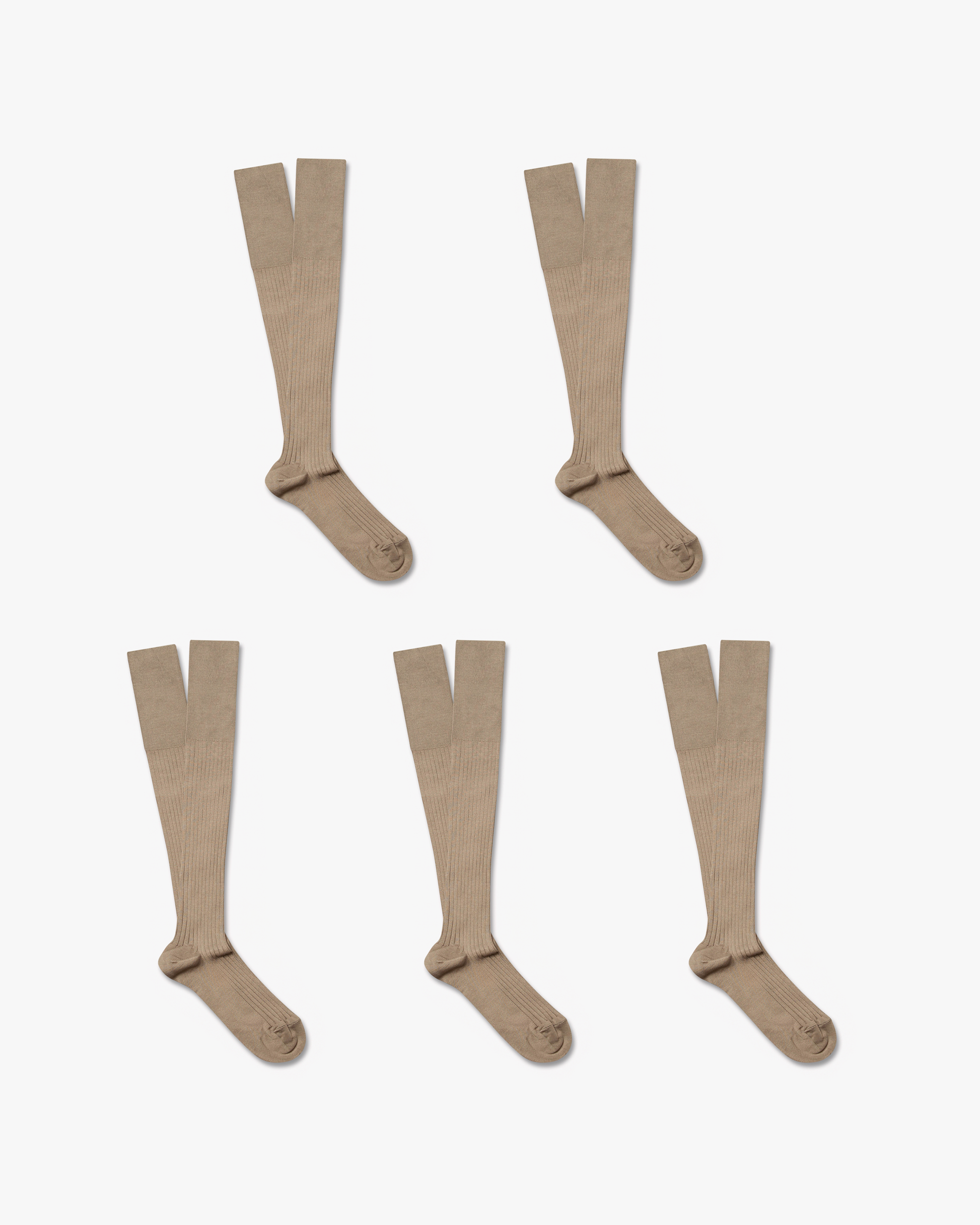 Five pairs of beige, ribbed Nils – Knee-High Cotton Socks laid out flat on a white background.