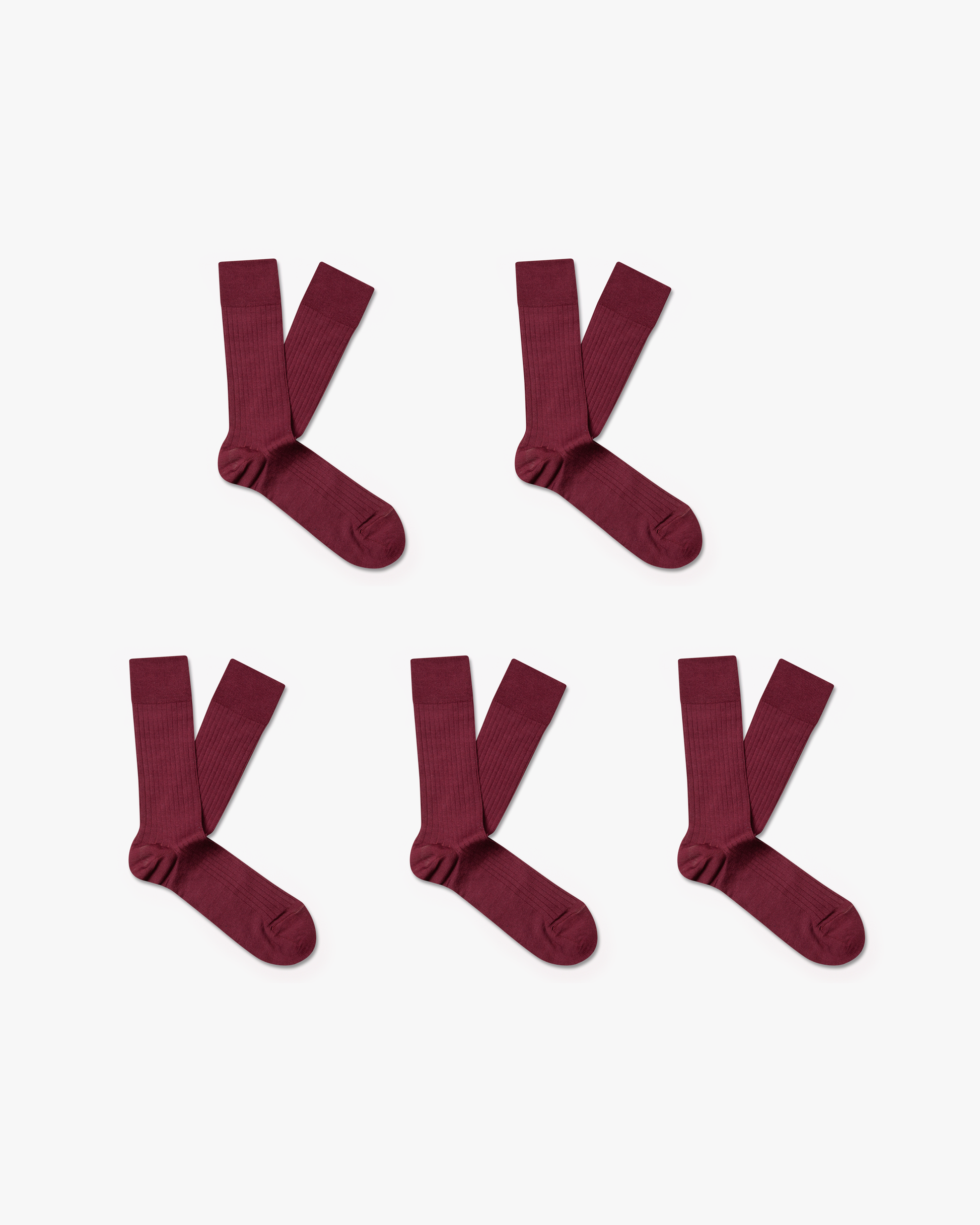 Flat lay of five pairs of Axel – Cotton Socks in a burgundy, ribbed material, arranged against a white background.