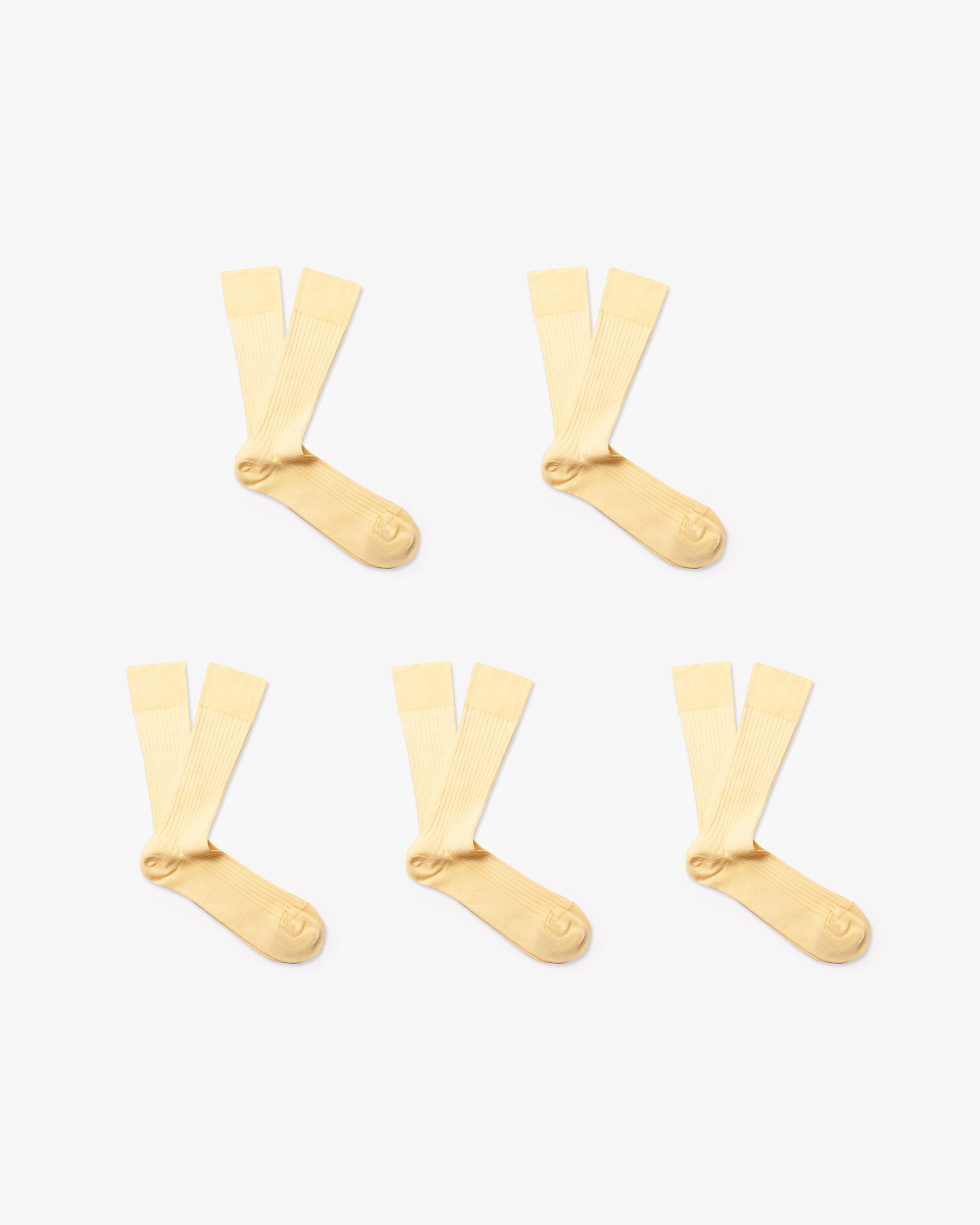 Five pairs of light yellow, ribbed Axel – Cotton Socks arranged on a white background.