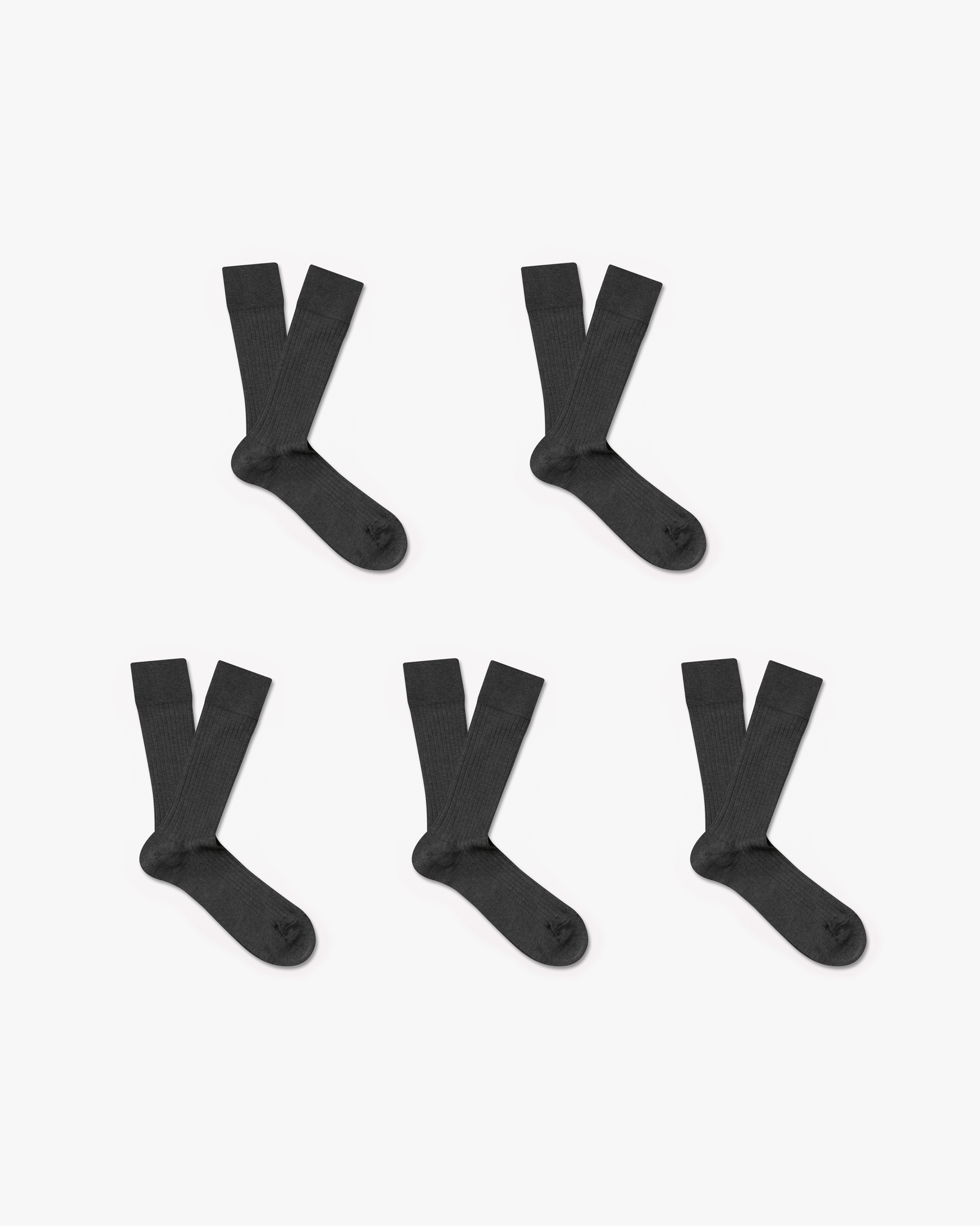 A studio shot of the Axel – Cotton Socks – 5-pack, displaying five pairs of dark grey ribbed socks on a white background.