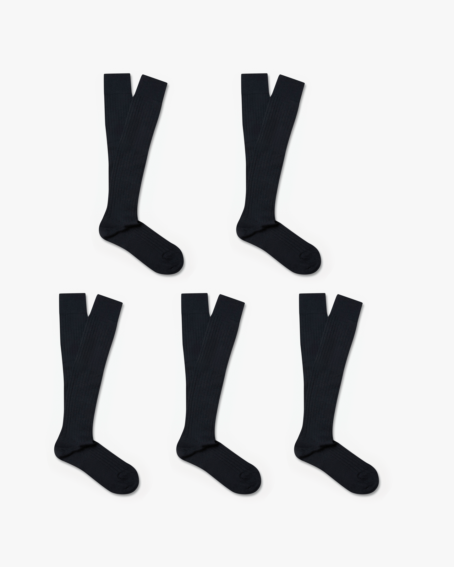 A flat lay of five pairs of black ribbed Gustav – Knee-High Merino Socks against a white background.