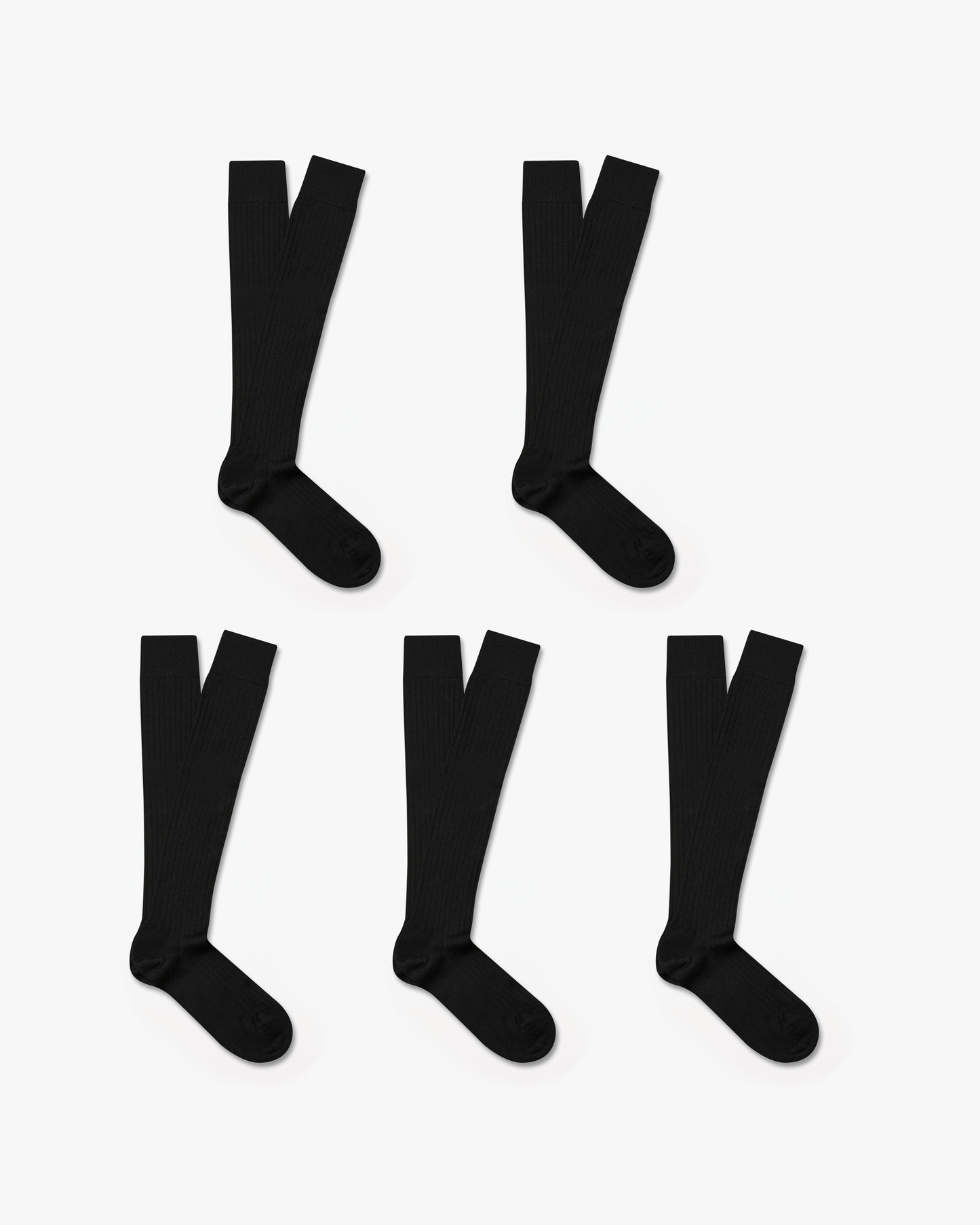 Five pairs of Gustav – Knee-High Merino Socks in black, laid flat to showcase the ribbed texture and length.