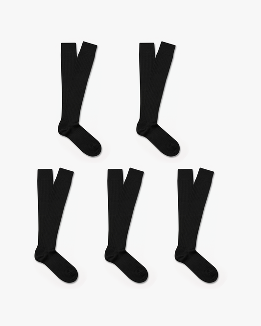 Five pairs of Gustav – Knee-High Merino Socks in black, laid flat to showcase the ribbed texture and length.