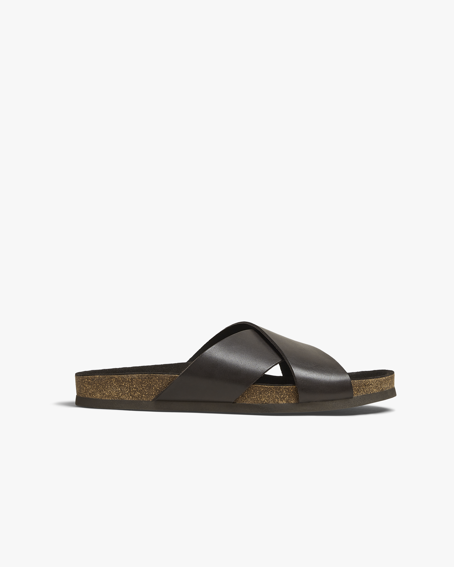 A close-up of the Solvik – Dark Brown Calf sandal, detailing the side profile, criss-cross straps, and cork sole.