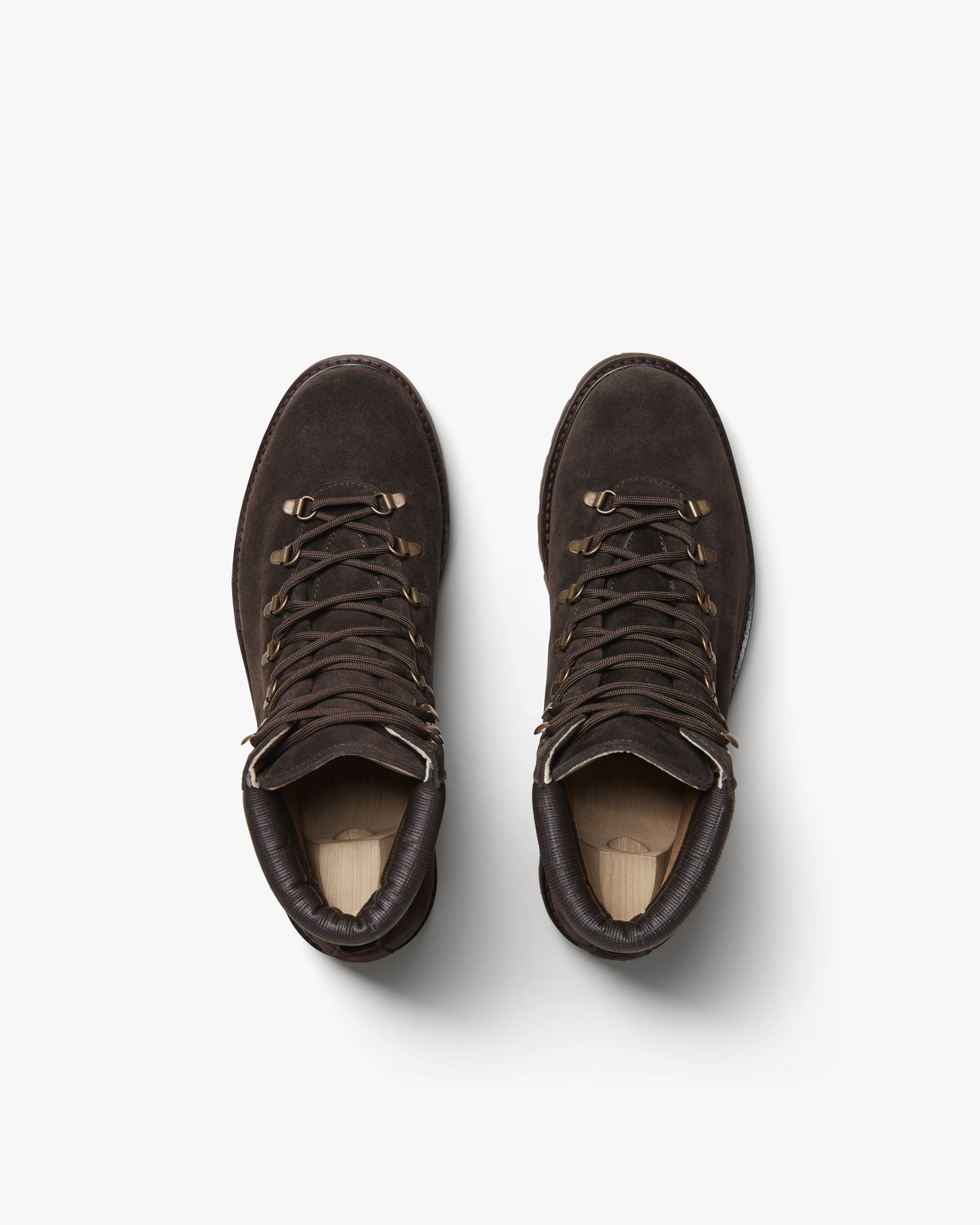 A pair of Duved II – Dark Brown Suede hiking boots with shoe trees, shot from above on a white background.