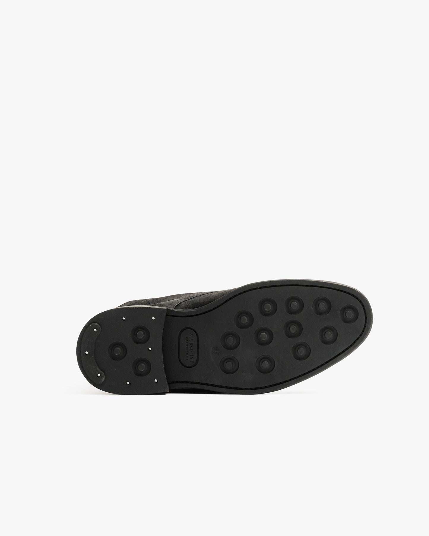 Close-up of the sole of Abisko in black waxed suede, featuring a double studded rubber sole designed for reliable traction and durability in winter conditions.