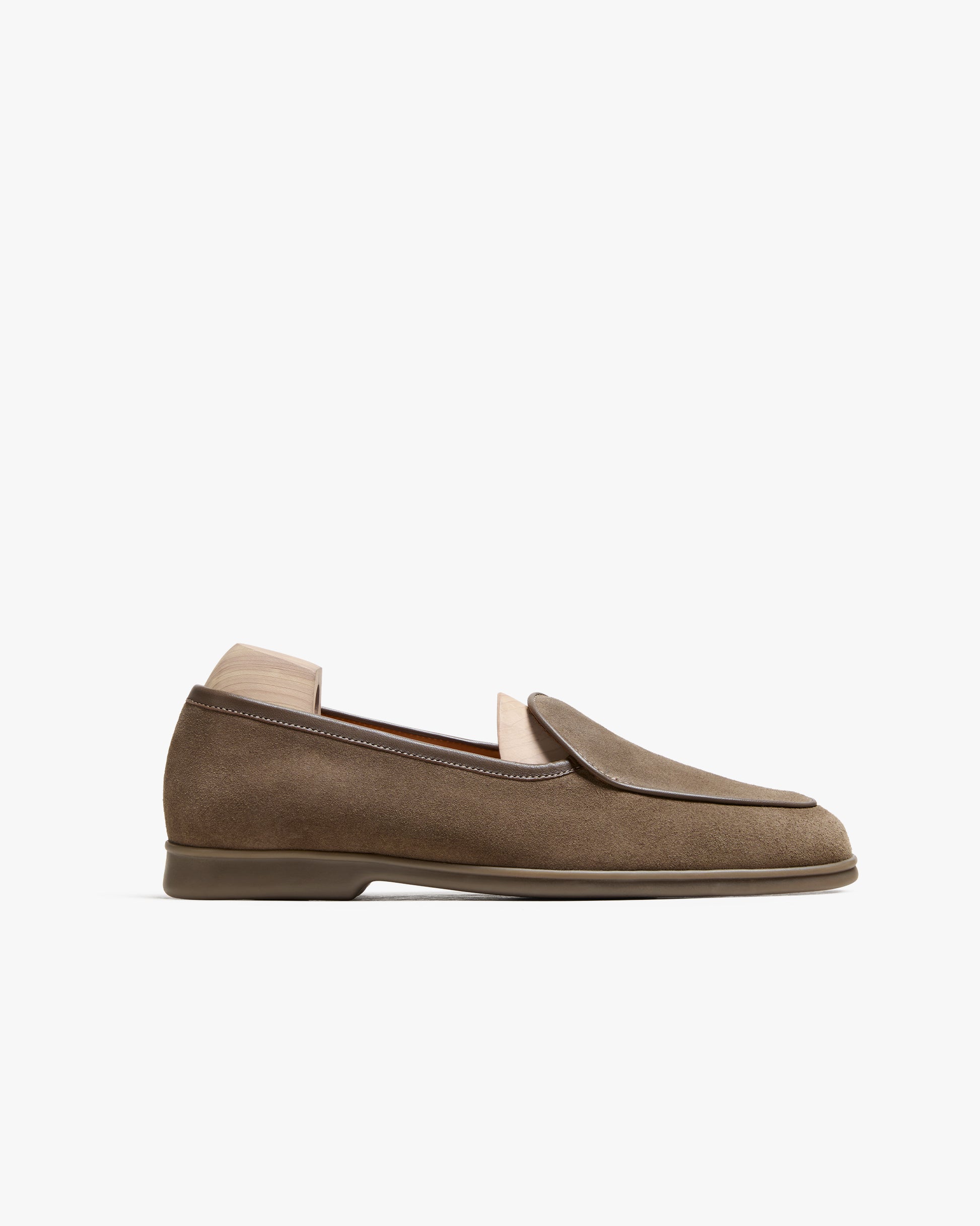 A side profile view of the Ängby Walker – Taupe Suede loafer, detailing its silhouette and rubber walker sole.