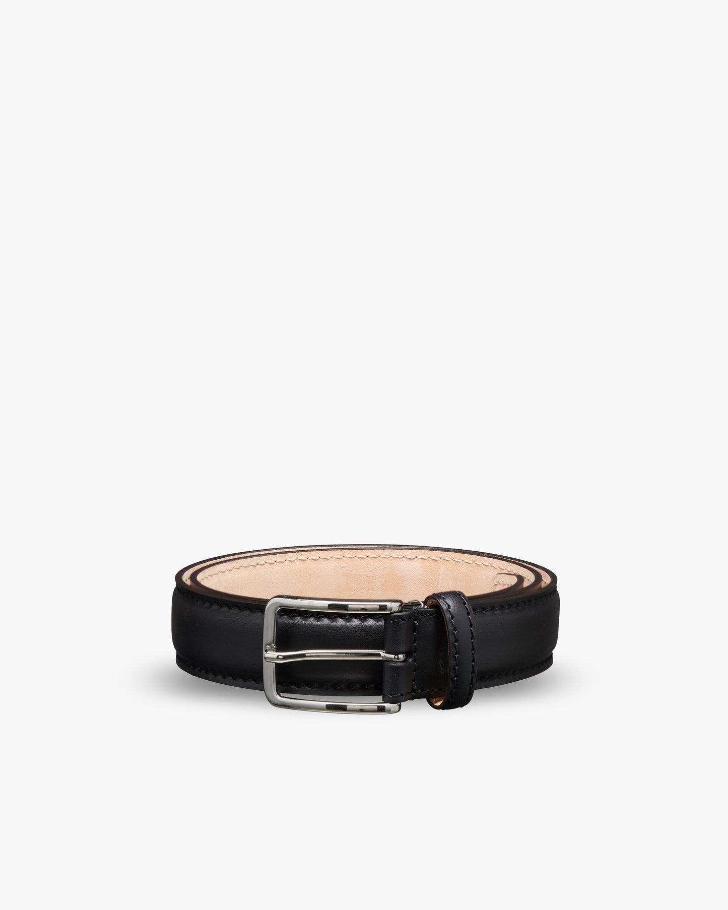 A studio shot of the Belt – Black Leather, featuring the square silver buckle, coiled against a white background.