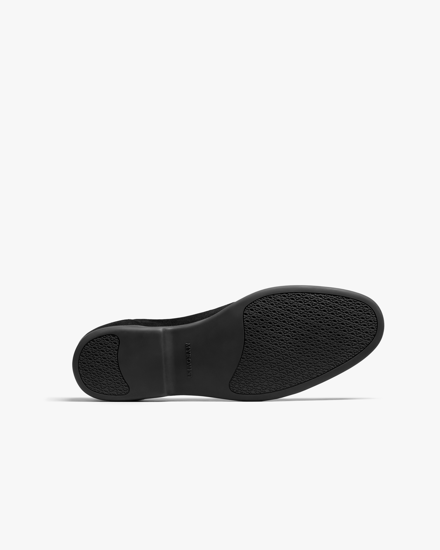 A detailed view of the full black rubber sole of the Brännö II – Black Suede loafer.
