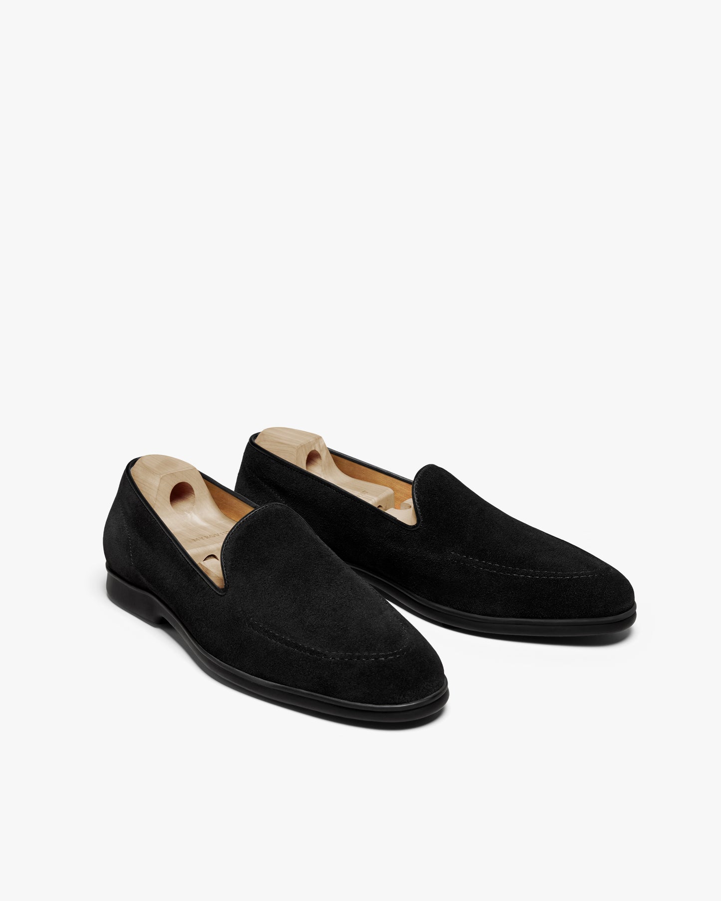 A pair of Brännö II – Black Suede loafers, shot from a three-quarter angle against a white background.