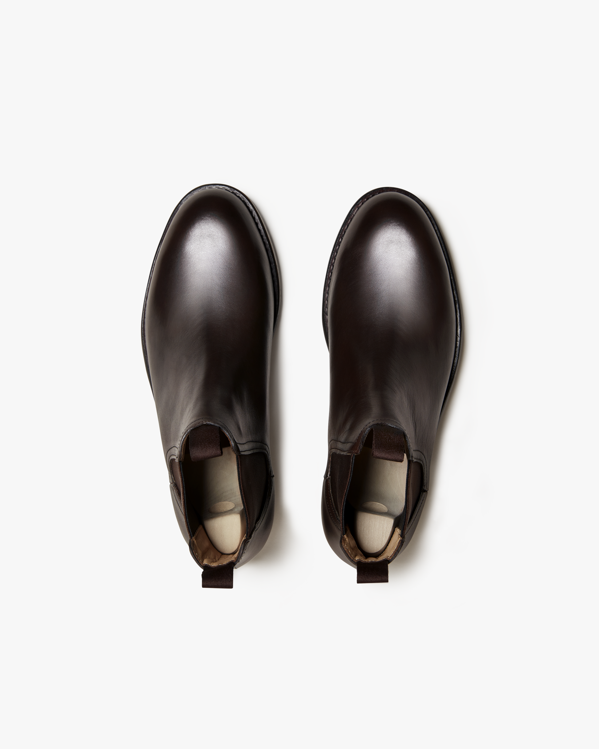 A top-down view of the Elfvik – Dark Brown Calf Chelsea boots, highlighting their rounded toe and elegant shape.