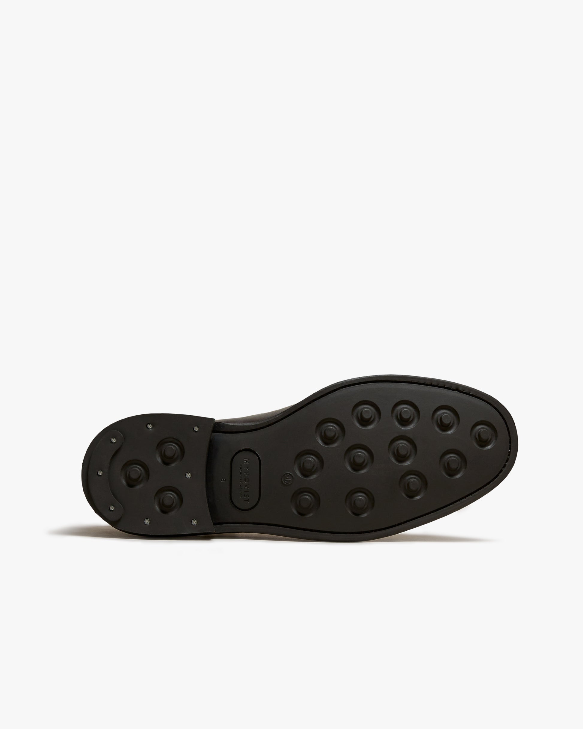 A close-up of Elfvik – Dark Brown Suede, detailing the studded rubber sole.