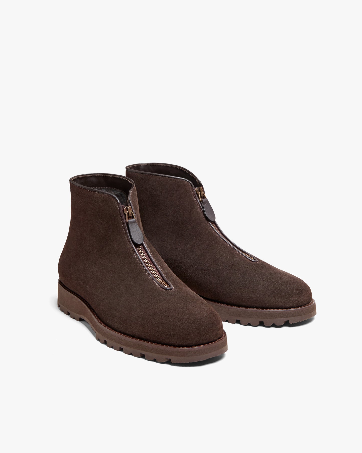 A pair of Funäs – Dark Brown Suede boots, shown at a three-quarter angle to display the front zipper and hiking sole.