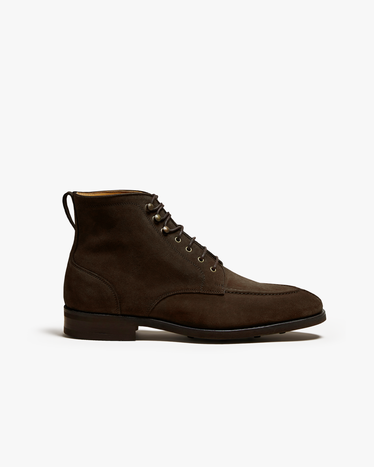 A side profile view of the Gothem – Dark Brown Suede jumper boot against a white background.