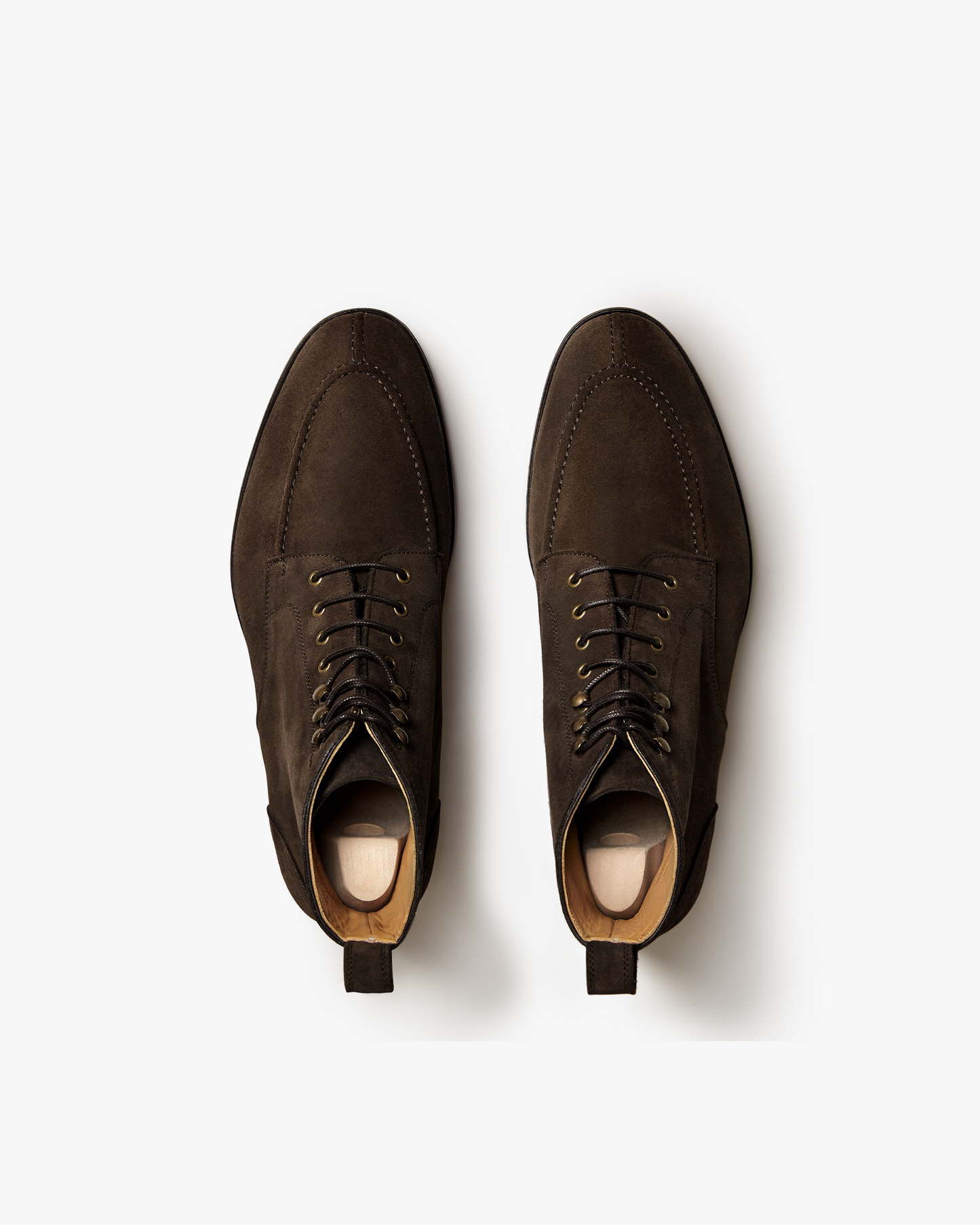 An overhead view of Gothem – Dark Brown Suede jumper boots, showing the split-toe stitching on a white background.