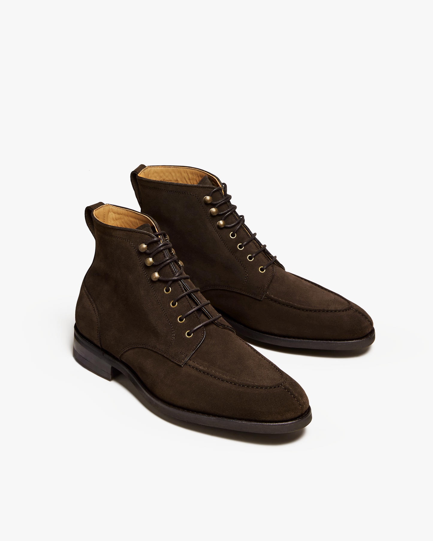 A pair of Gothem – Dark Brown Suede jumper boots, angled to show the apron-fronted split-toe detail and lacing.