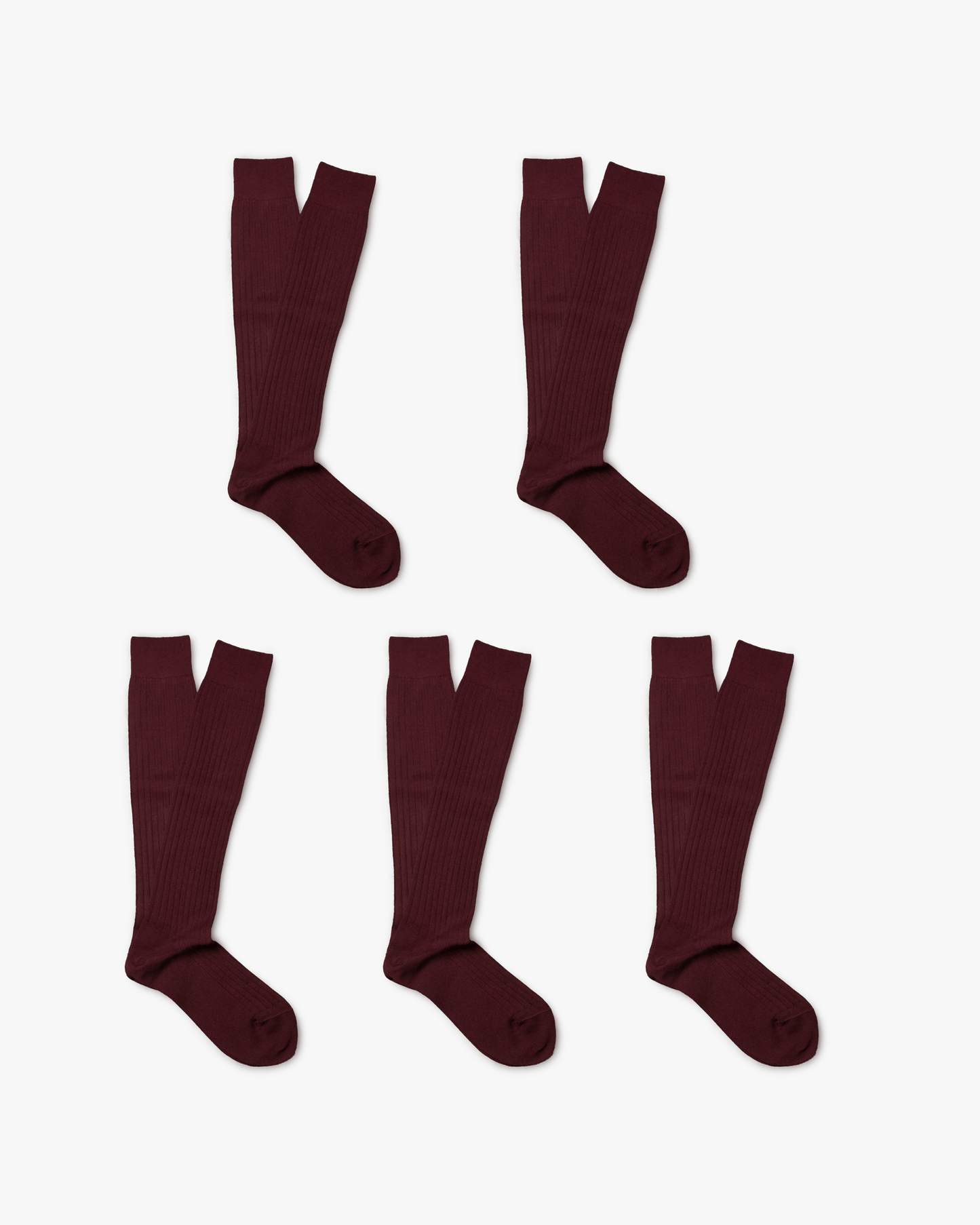 Studio shot of Gustav – Knee-High Merino Socks 5-pack, showing five pairs of burgundy ribbed socks.