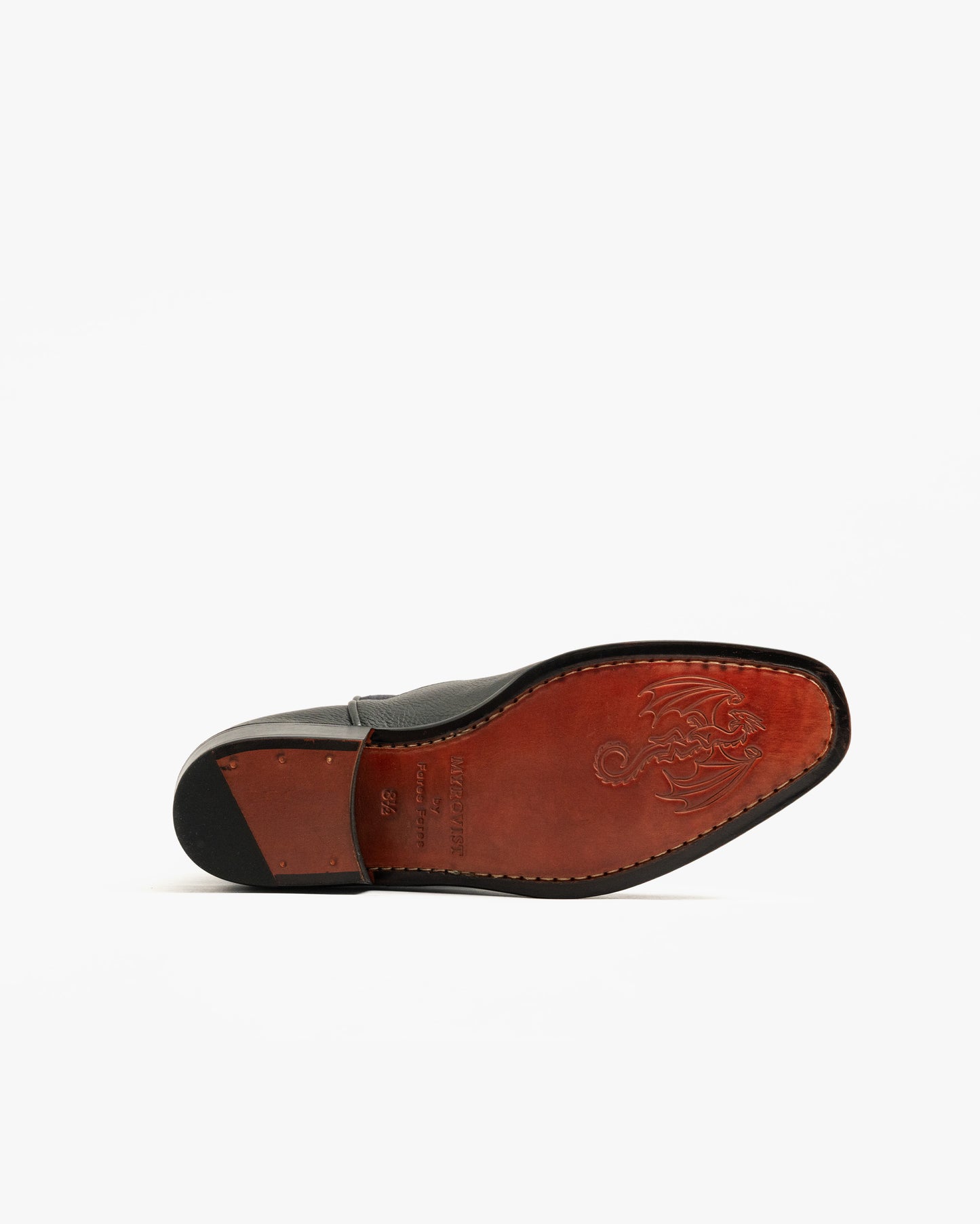 Underside view of the Karlslund – Fares Edition boot, showcasing its leather sole with a unique embossed dragon design.