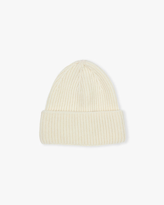 A ribbed hat in cream, made from a blend of merino wool and cashmere, pictured against a white background.