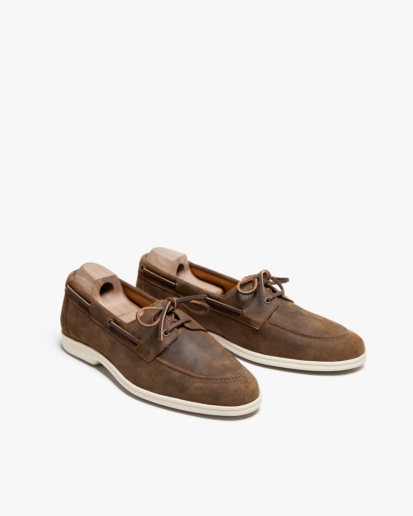 A pair of Sandhamn – Chestnut Waxed Suede boat shoes on a white background.