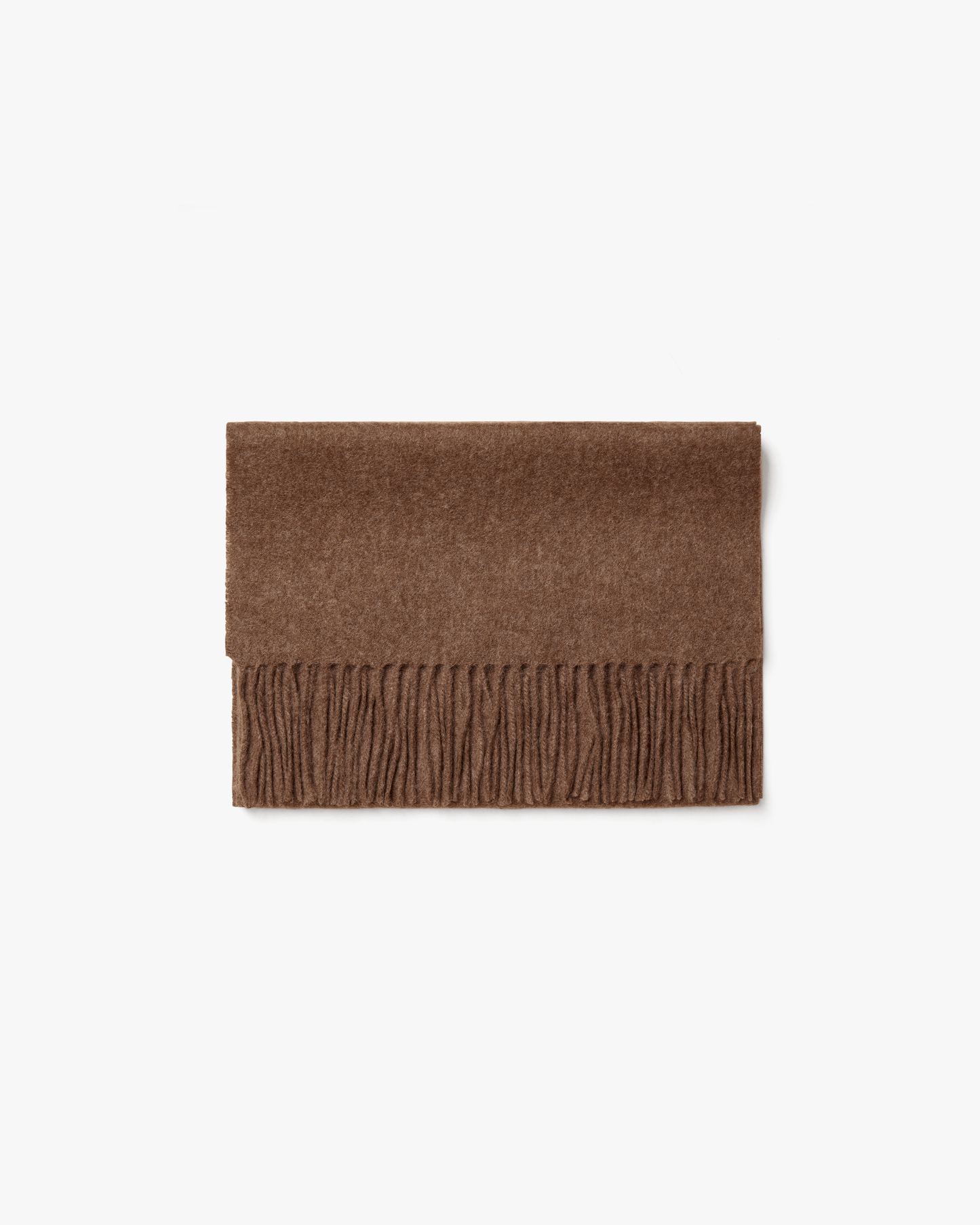 A flat lay of the Wool Scarf – Taupe, folded on a white background to showcase its texture and fringed edge.