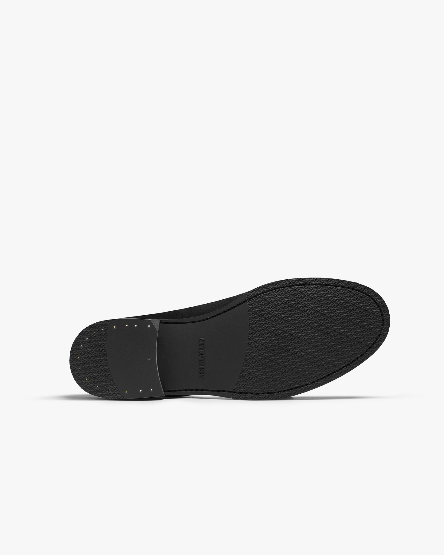 Close-up of the sole of Vinterviken II in dark brown calf, featuring a durable black rubber outsole with subtle texture and reinforced heel detailing.