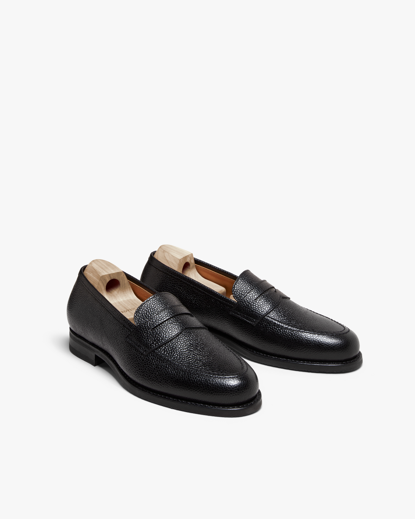 A pair of Stenhammar II – Black Country Calf loafers in textured black leather, photographed against a white background.
