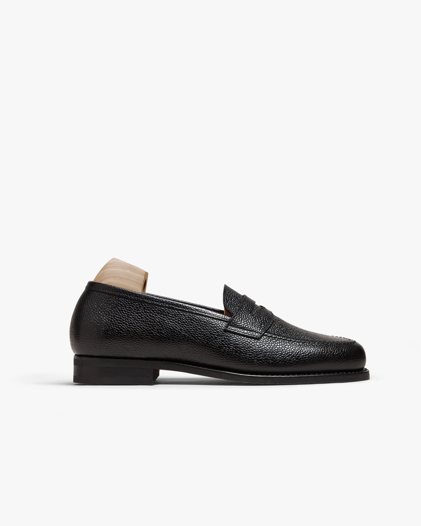 A close-up of Stenhammar II – Black Country Calf loafer, detailing the side profile and textured country calf leather.