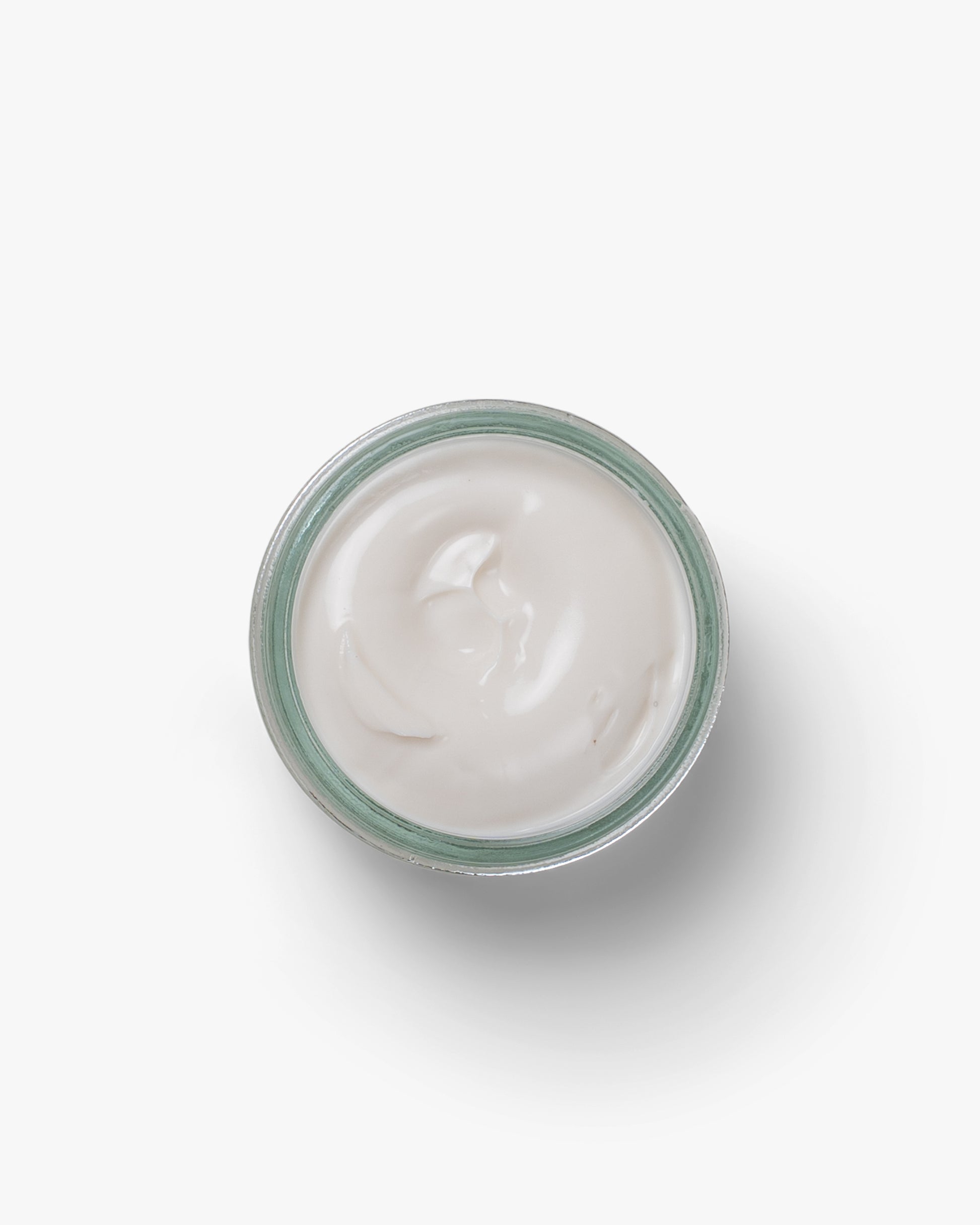 An open jar of white Shoe Cream – Myrqvist, photographed from above against a white background.