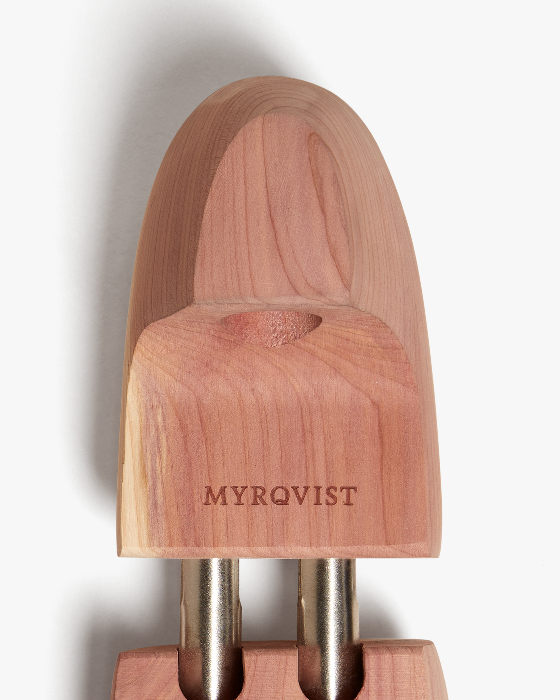 A close-up of Myrqvist's Shoe Tree – Cedar Wood, detailing the engraved logo and the natural grain of the wood.