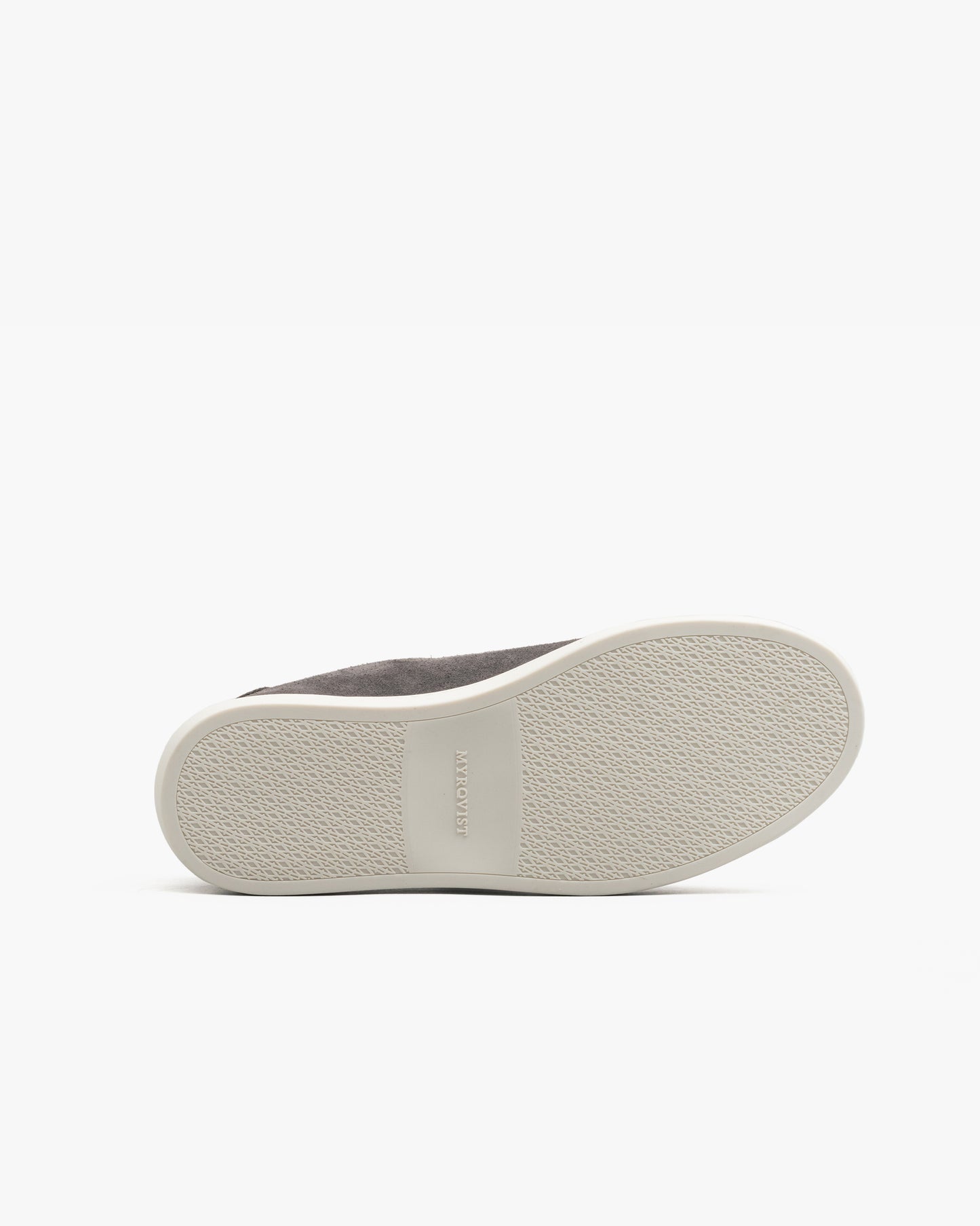 Oaxen in dark grey suede shown with the sole facing up, highlighting the textured off-white M-pattern sole with MYRQVIST branding at the center.
