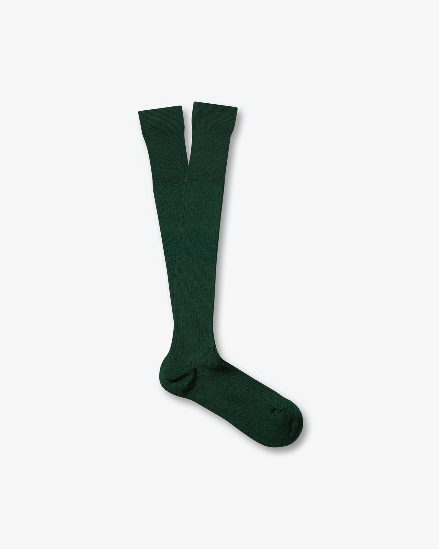 A studio photograph of the Nils – Knee-High Cotton Socks in dark green, laid flat against a white background.