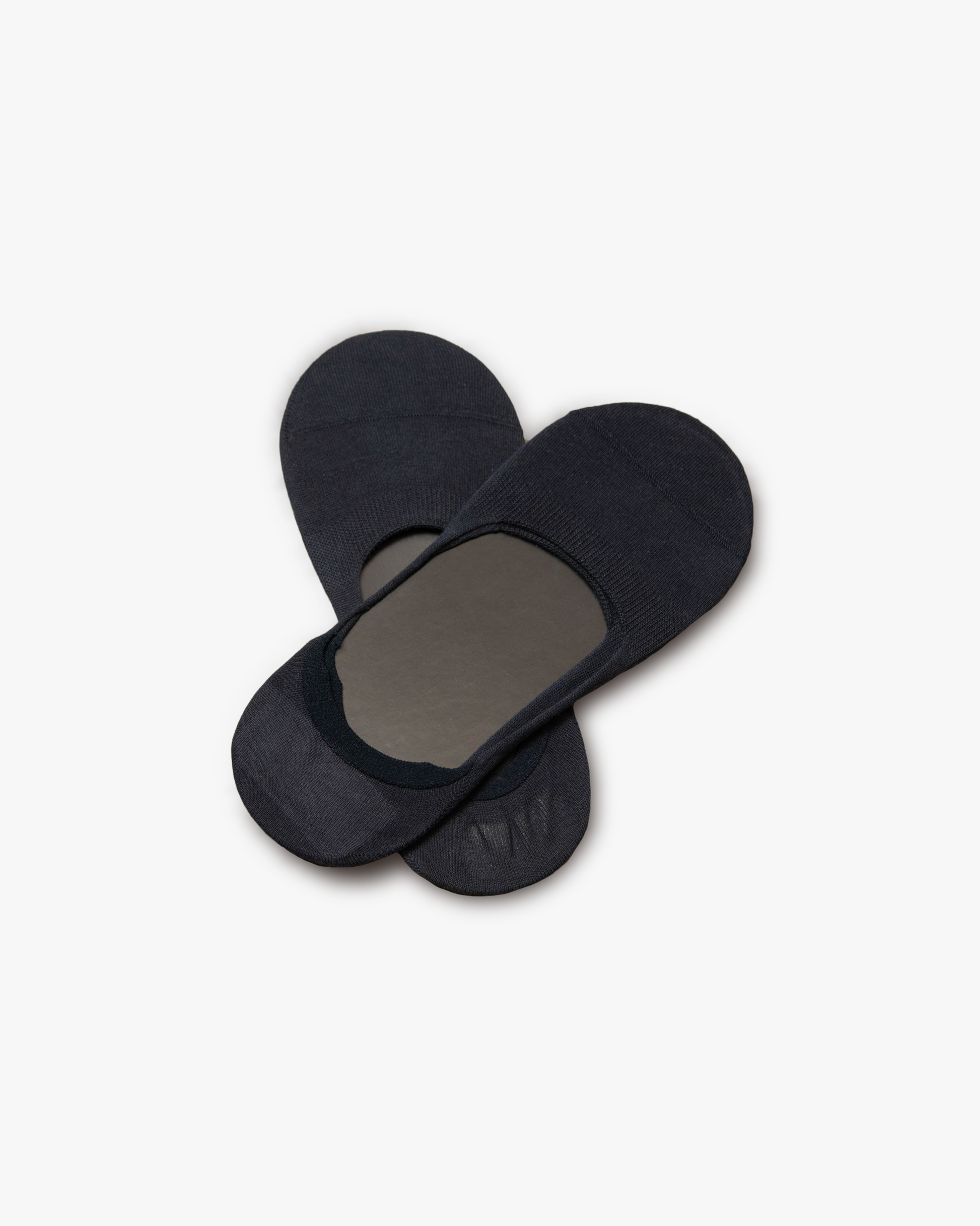 A pair of dark blue Lars – Cotton Loafer Socks photographed from above on a white studio background.