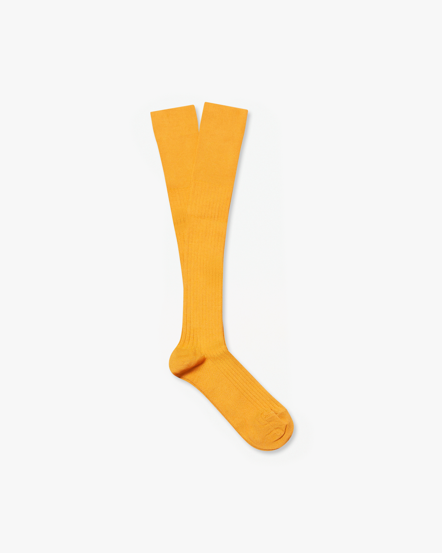 A pair of Nils – Knee-High Cotton Socks in mustard yellow, laid flat on a white background.