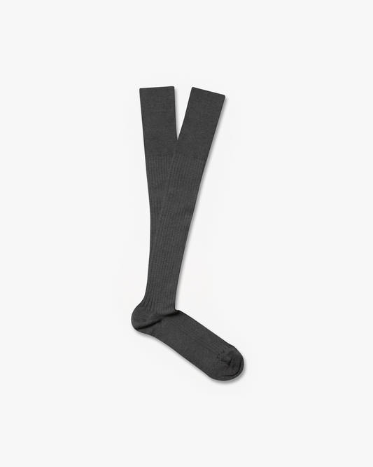 A pair of Nils – Knee-High Cotton Socks – Grey, laid flat on a white background showing the full length and ribbed texture.