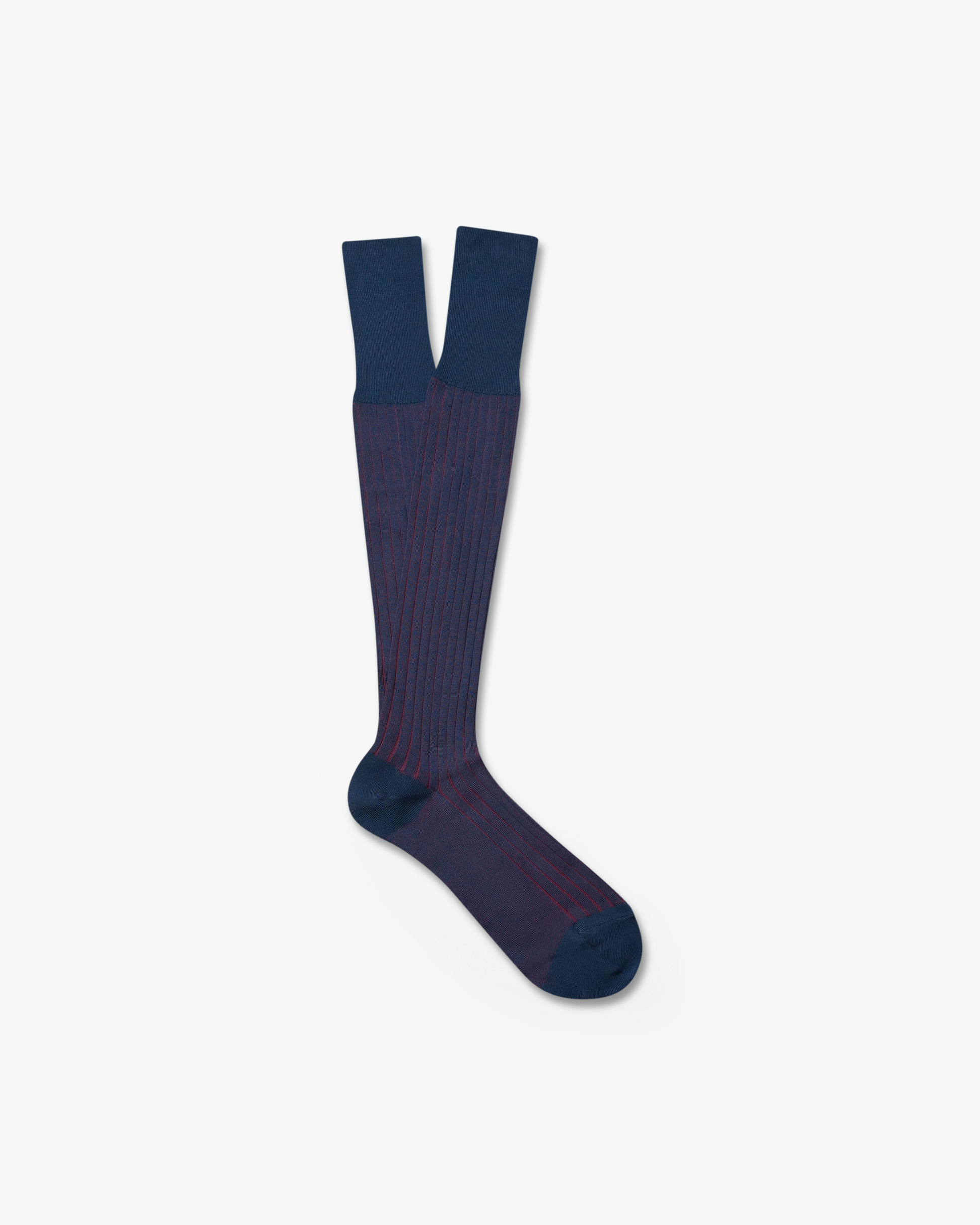 A pair of Erik – Knee-High Cotton Socks – Red, featuring a navy blue body with a red ribbed pattern, on a white background.