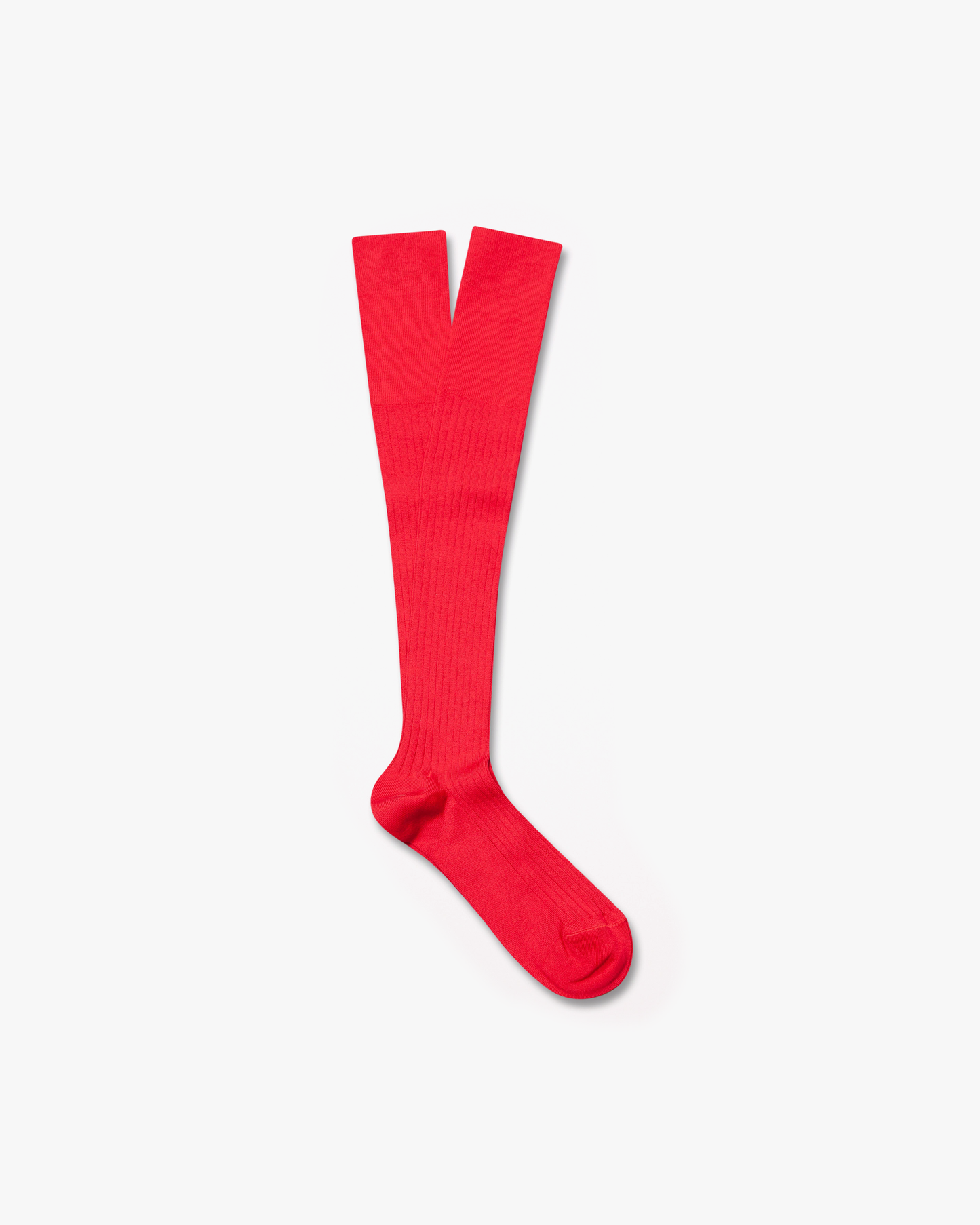 A pair of red, ribbed Nils knee-high socks laid out on a white background.