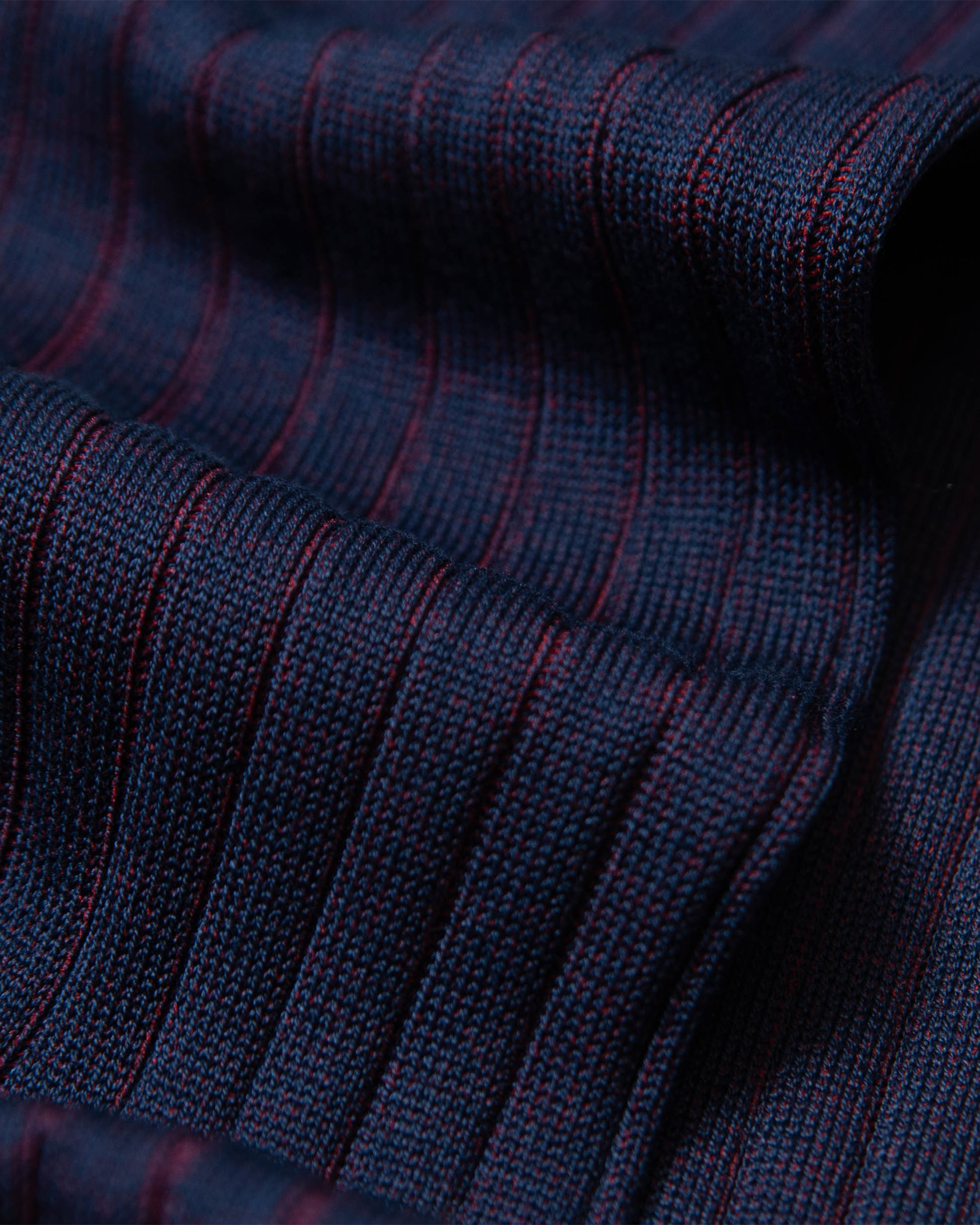 A close-up of Erik – Knee-High Cotton Socks in red, detailing the refined ribbed cotton texture.