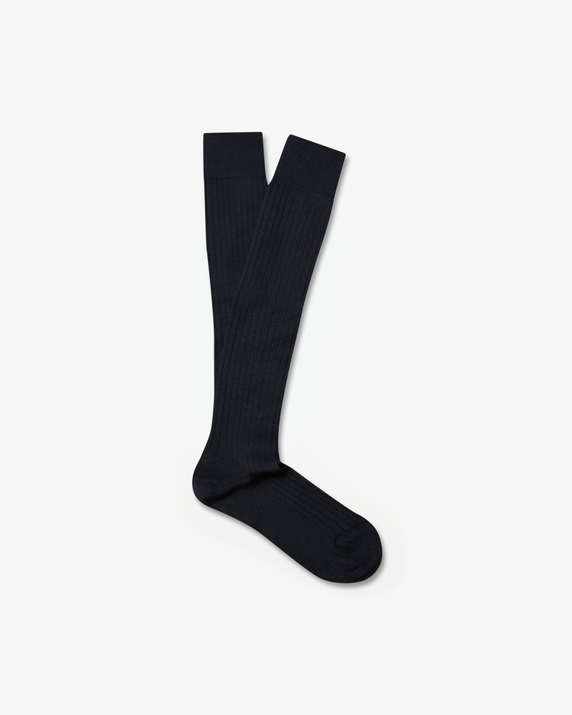 A pair of Gustav – Knee-High Merino Socks – Dark Grey laid flat against a white background.