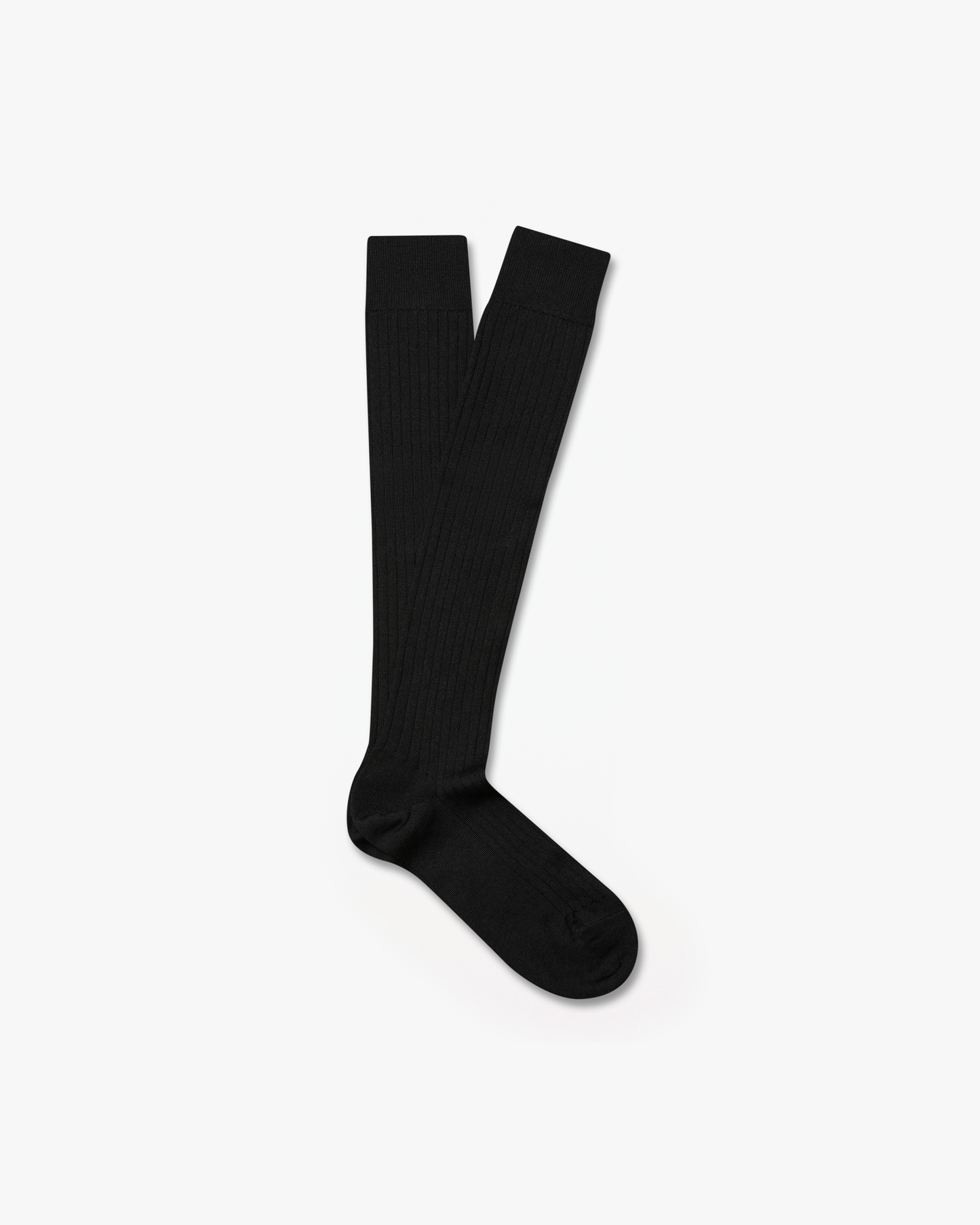 A pair of Gustav – Knee-High Merino Socks – Black, laid flat against a white background.