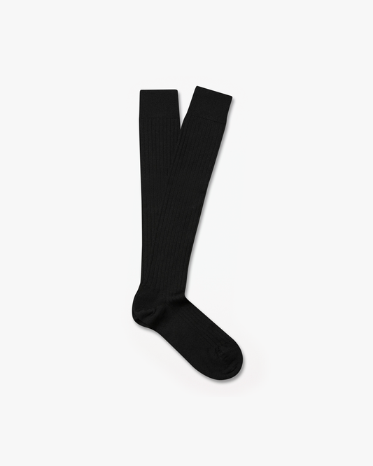 A pair of Gustav – Knee-High Merino Socks – Black, laid flat against a white background.