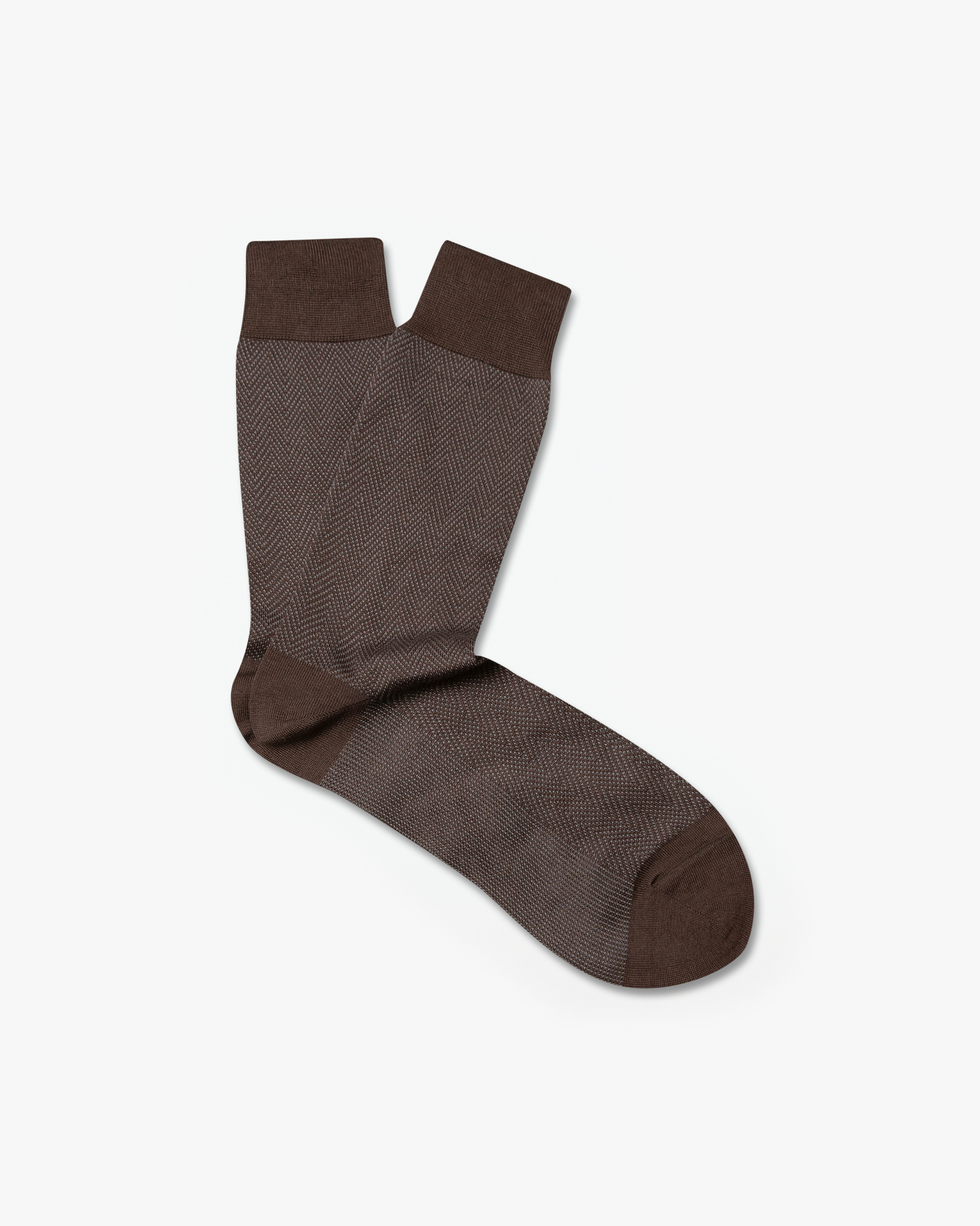 A pair of Arvid – Cotton Socks in brown with a herringbone pattern, shot against a white background.