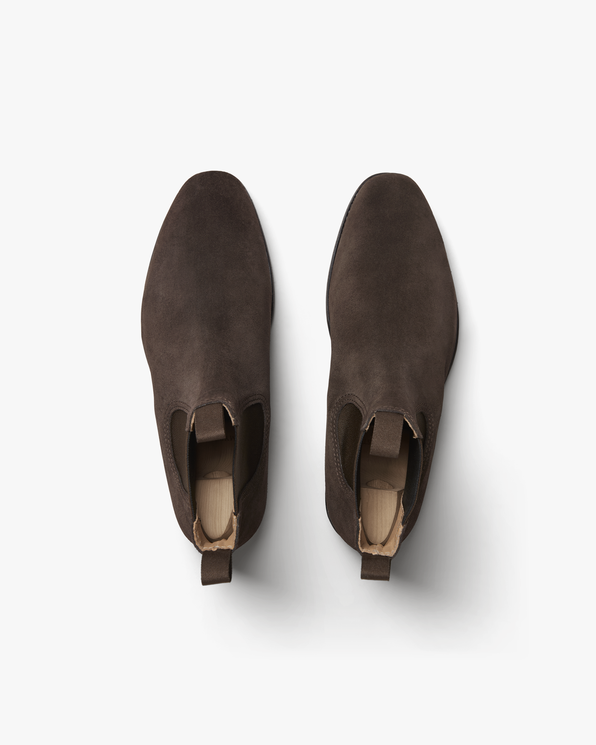 A pair of Granhult – Dark Brown Suede Chelsea boots photographed from directly above on a white background.