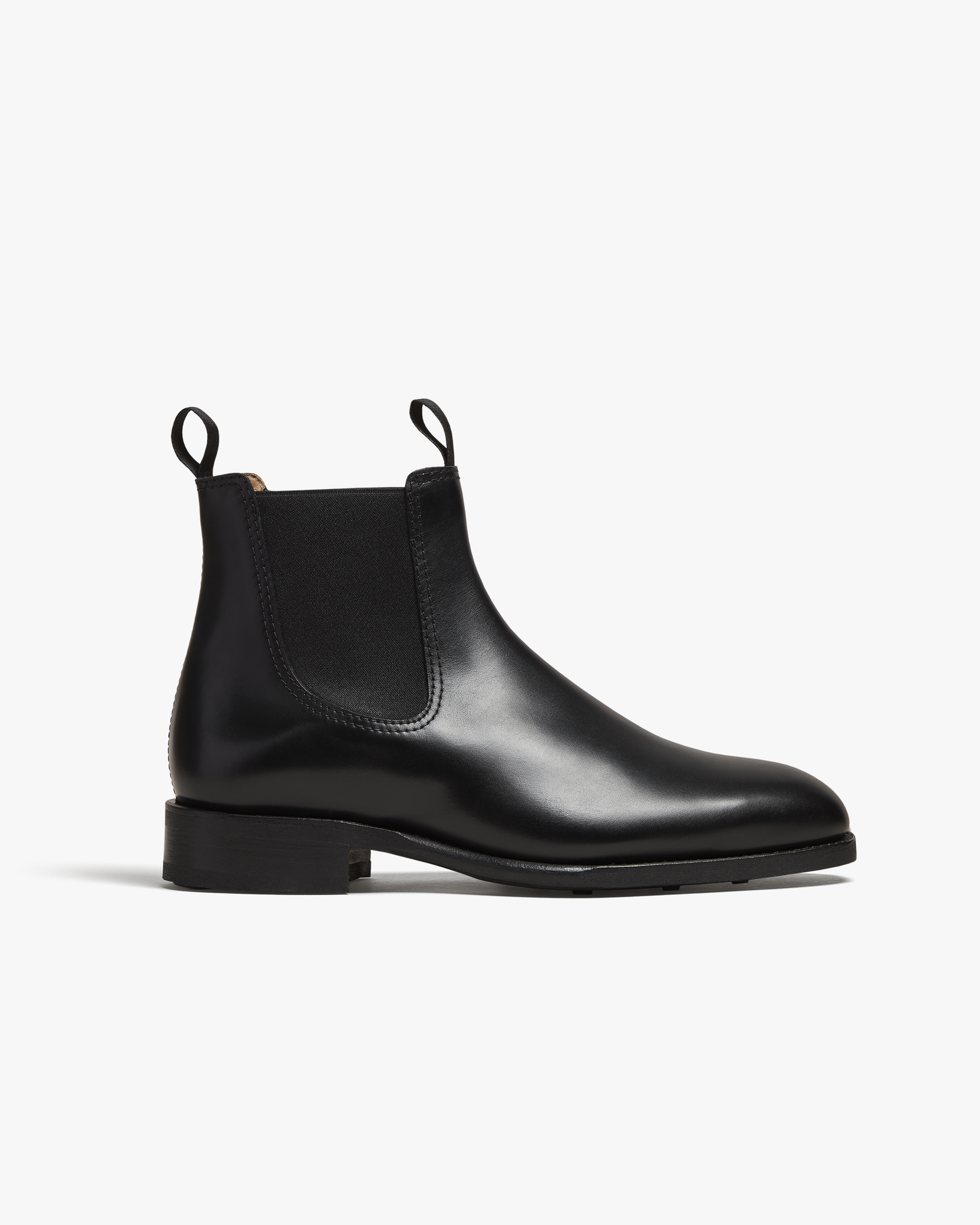 A studio shot of the Granhult – Black Calf Chelsea boot, showing its sleek side profile against a white background.